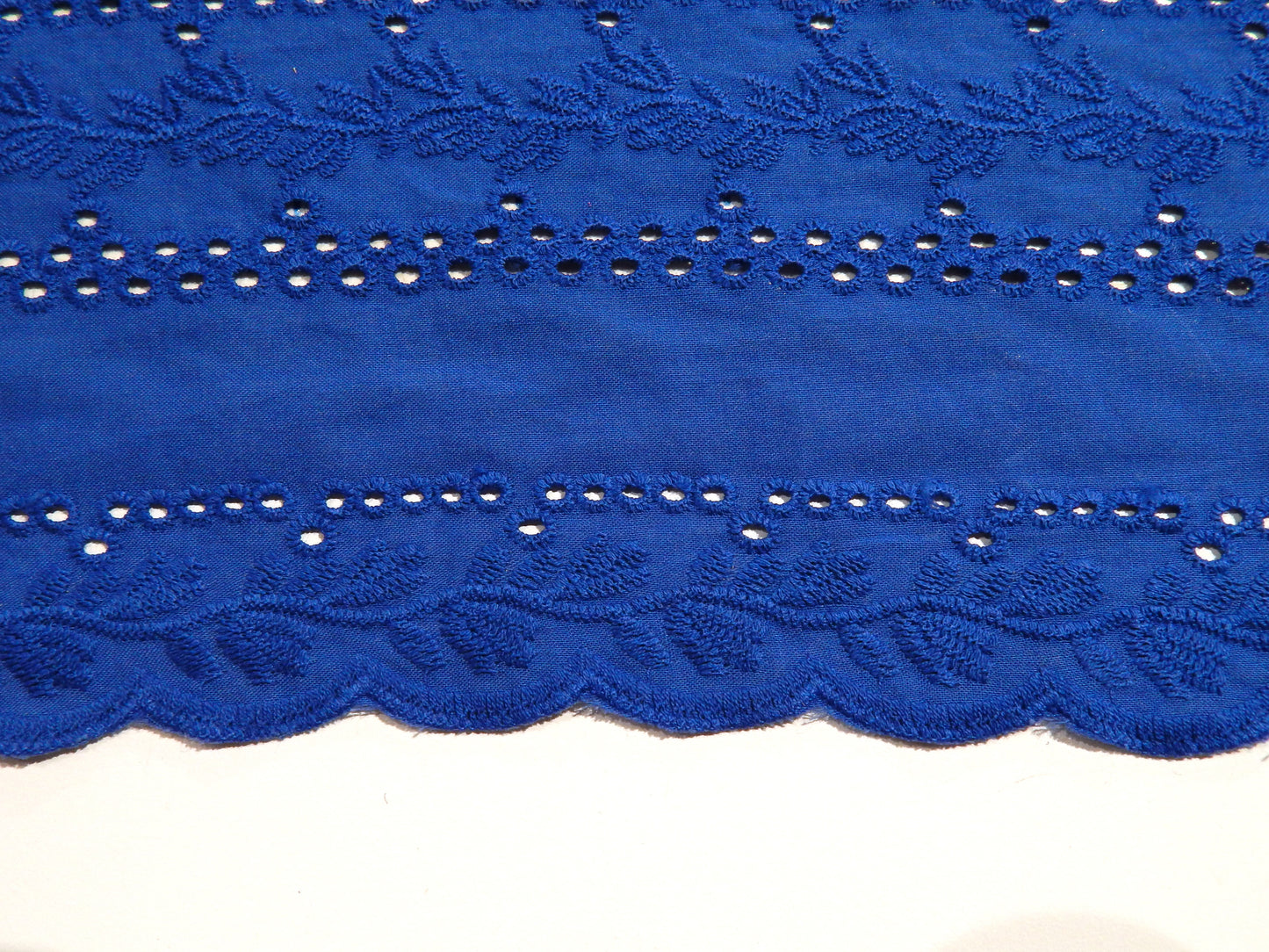 scallop bordered blue cotton eyelet with embroidery fabric