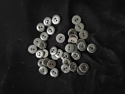 small black plastic buttons
