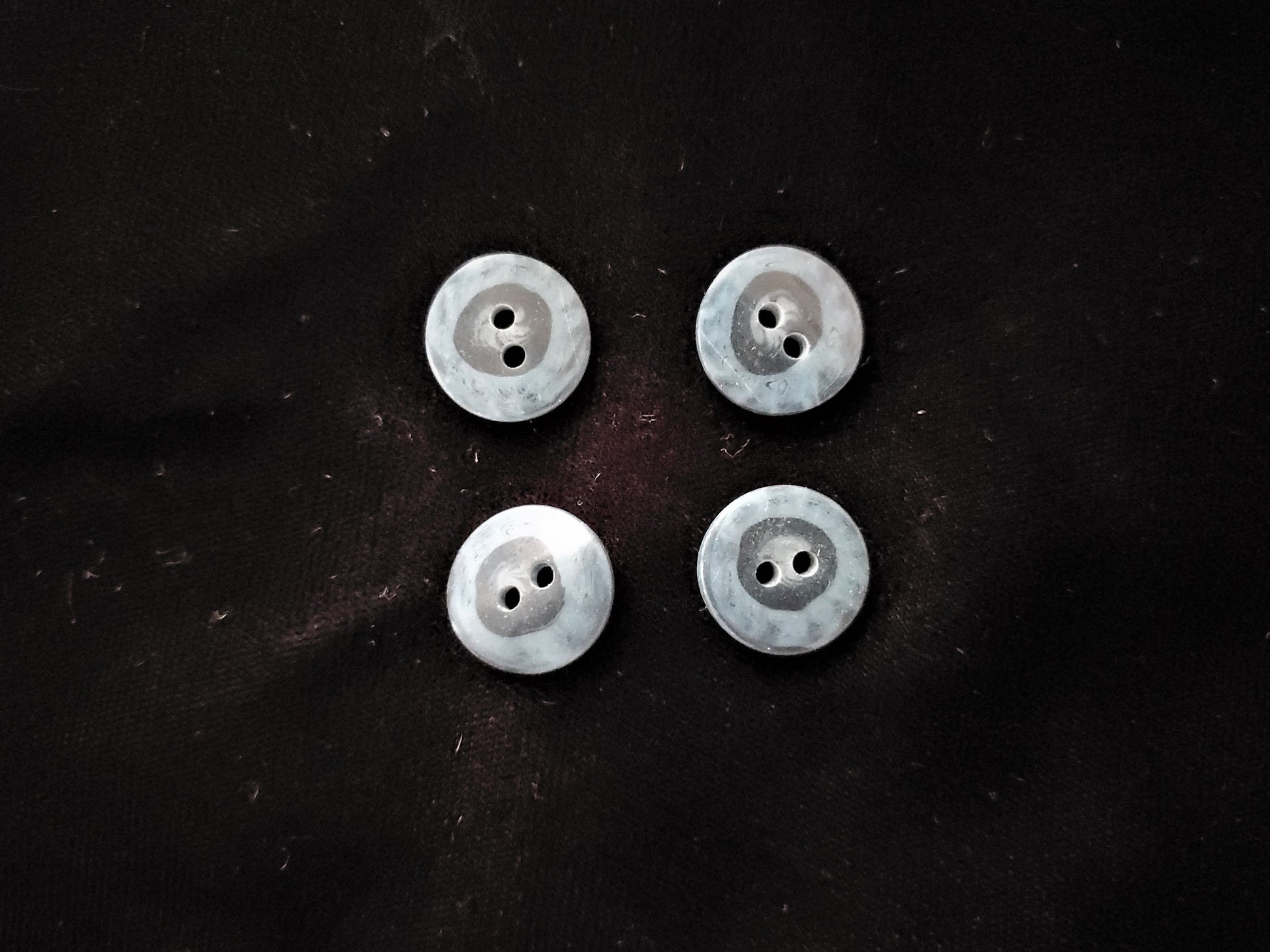 black and blue plastic buttons