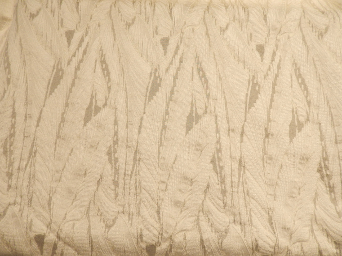 seraphim ivory brocade deadstock fabric on a black background