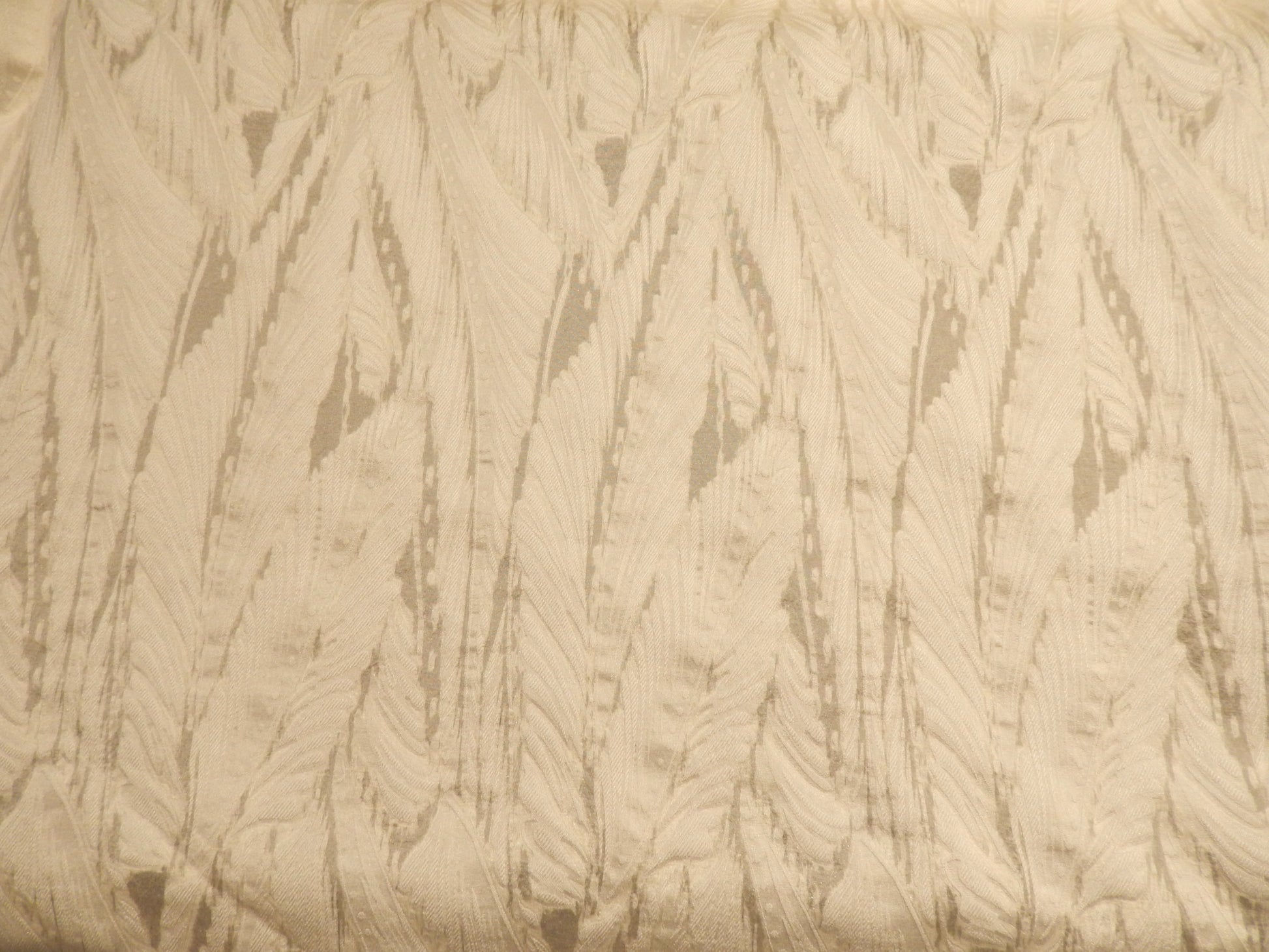 seraphim ivory brocade deadstock fabric on a black background