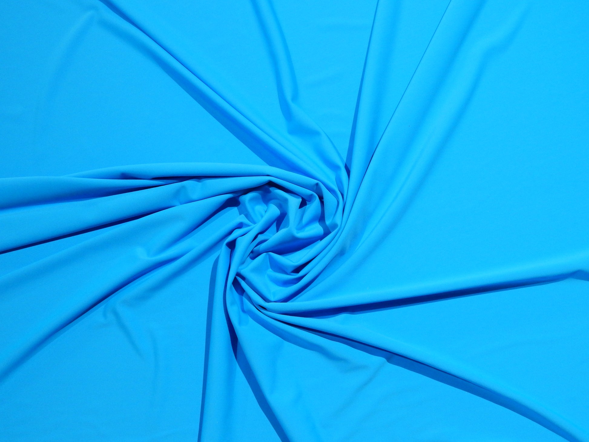 bright blue telio thalassa swim wear knit fabric for active wear