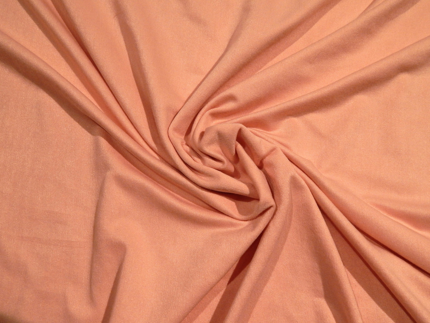 light rosey pink rayon jersey knit deadstock stretch fabrics