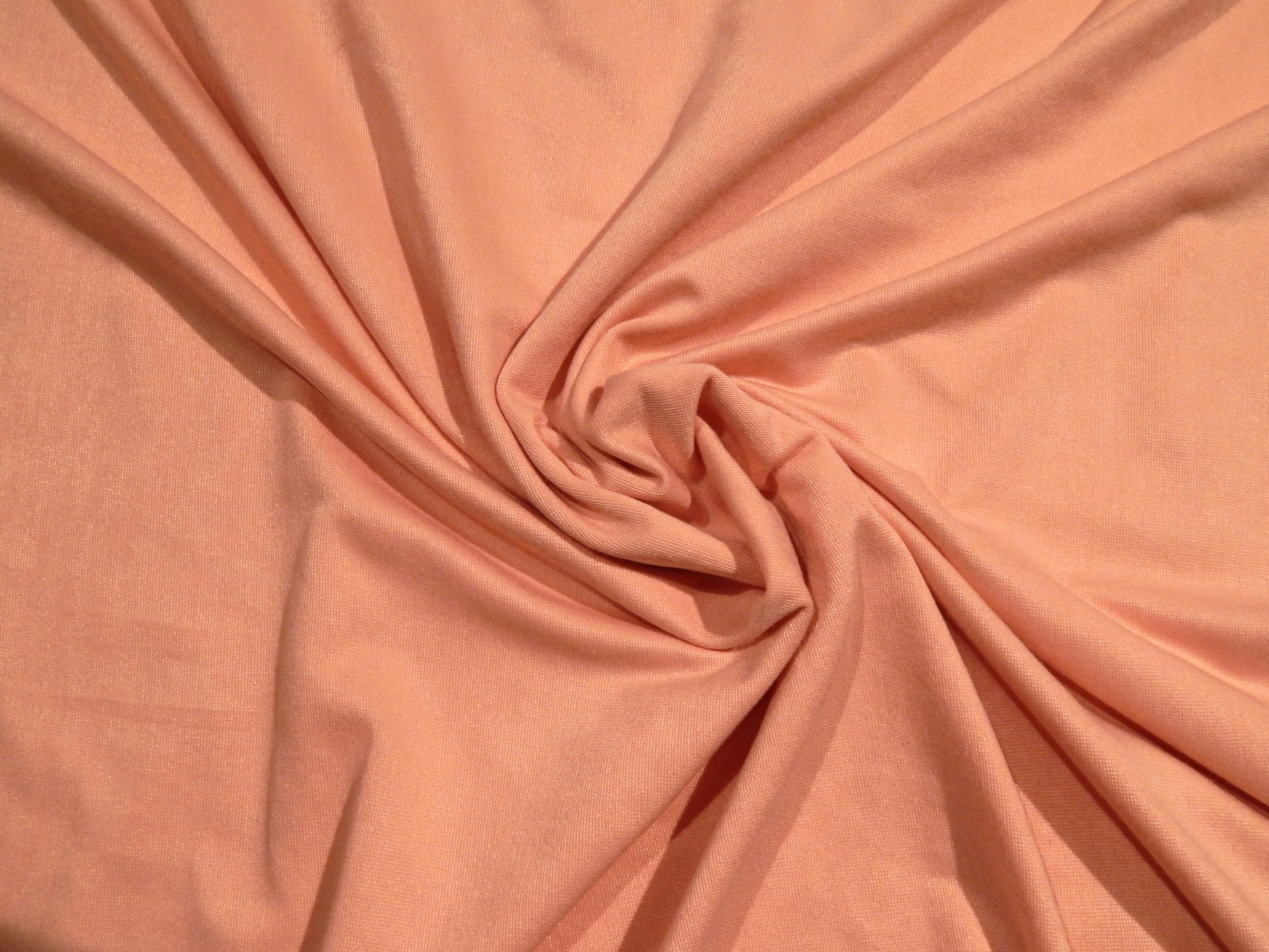 light rosey pink rayon jersey knit deadstock stretch fabrics