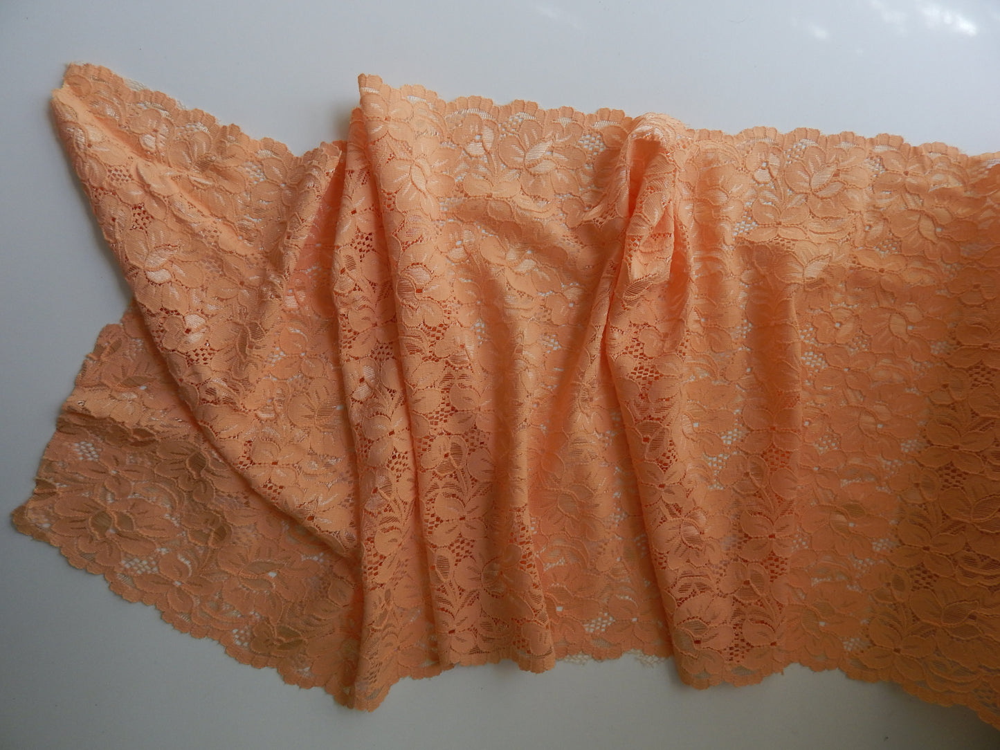 Peach stretch lace fabric