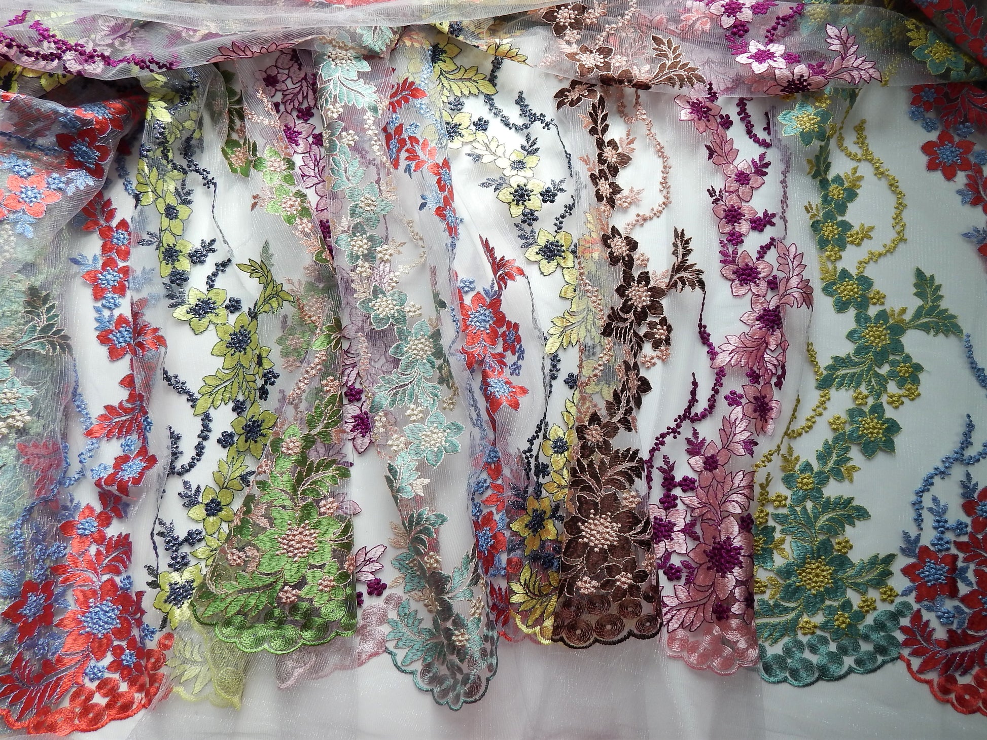 Multicolored scalloped floral lace fabric