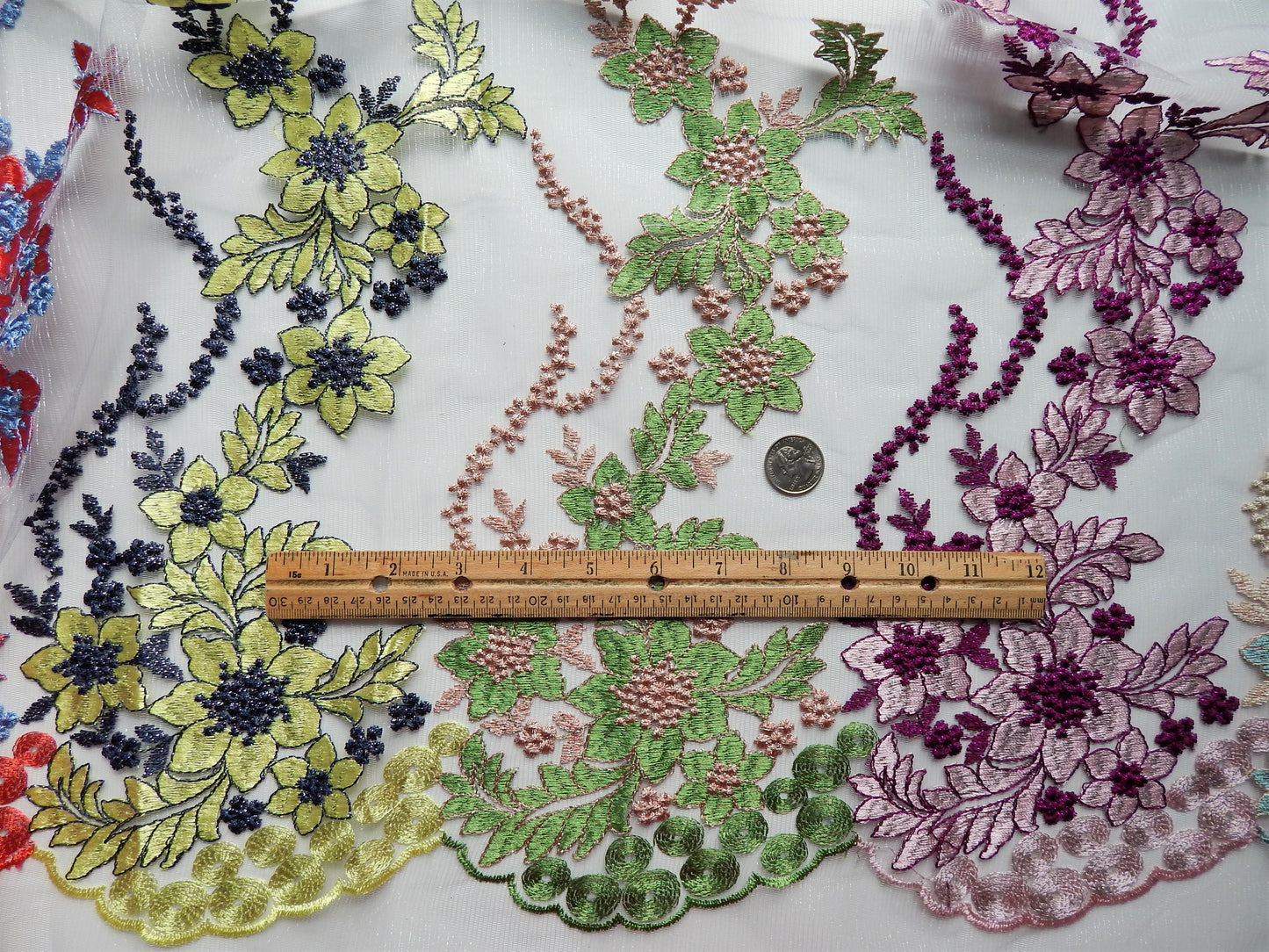 Yellow, green, and purple lace fabric