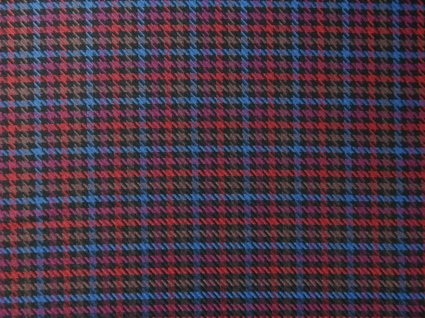 red, blue, and purple plaid fabric
