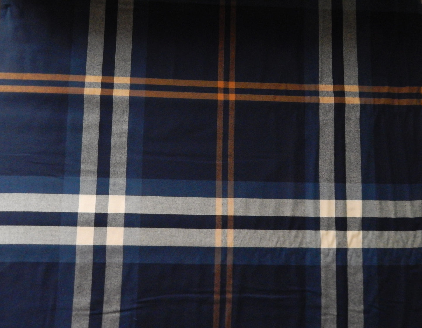 blue, white, and gold plaid fabric