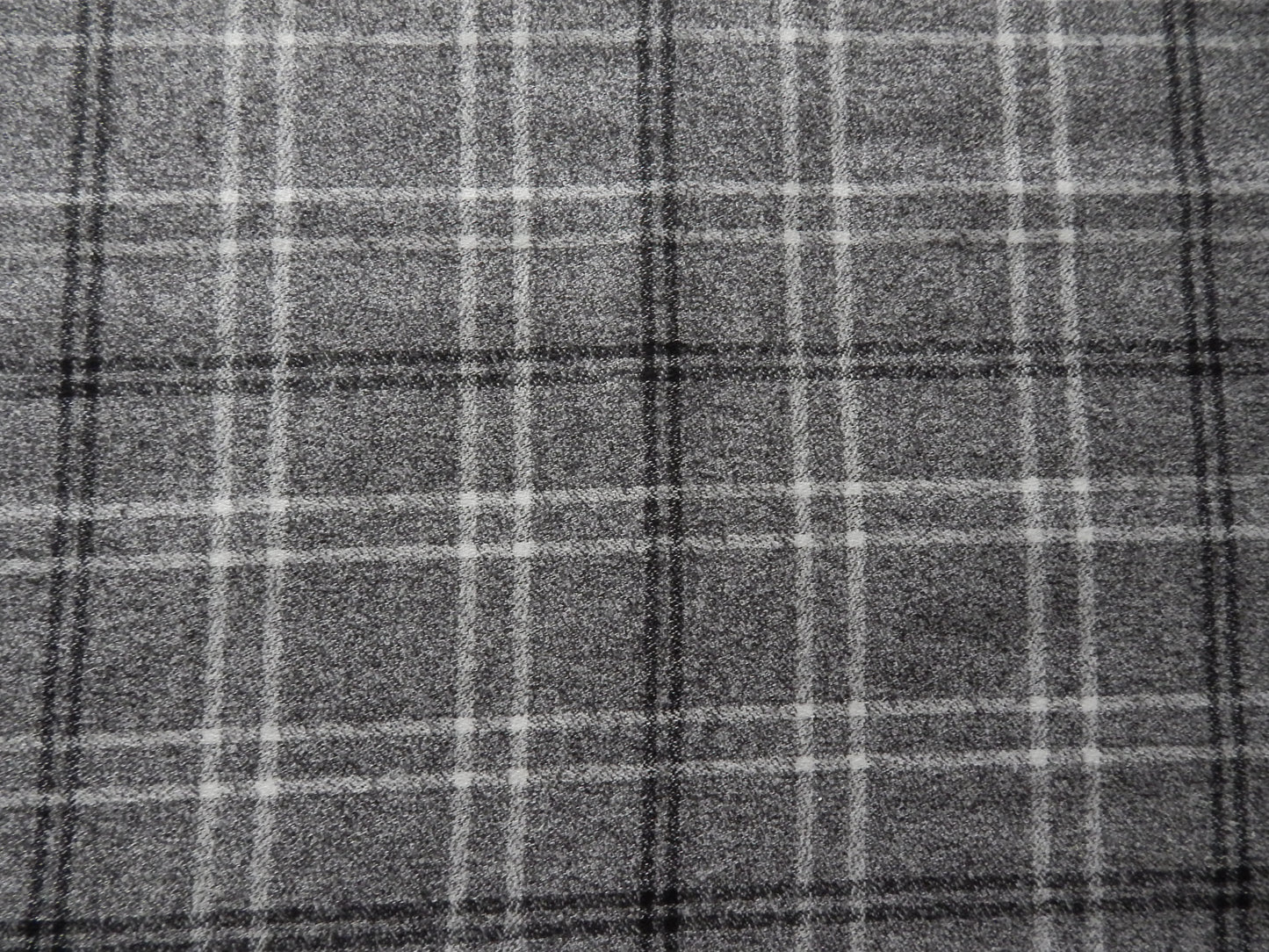 Grey, white, and black plaid fabric