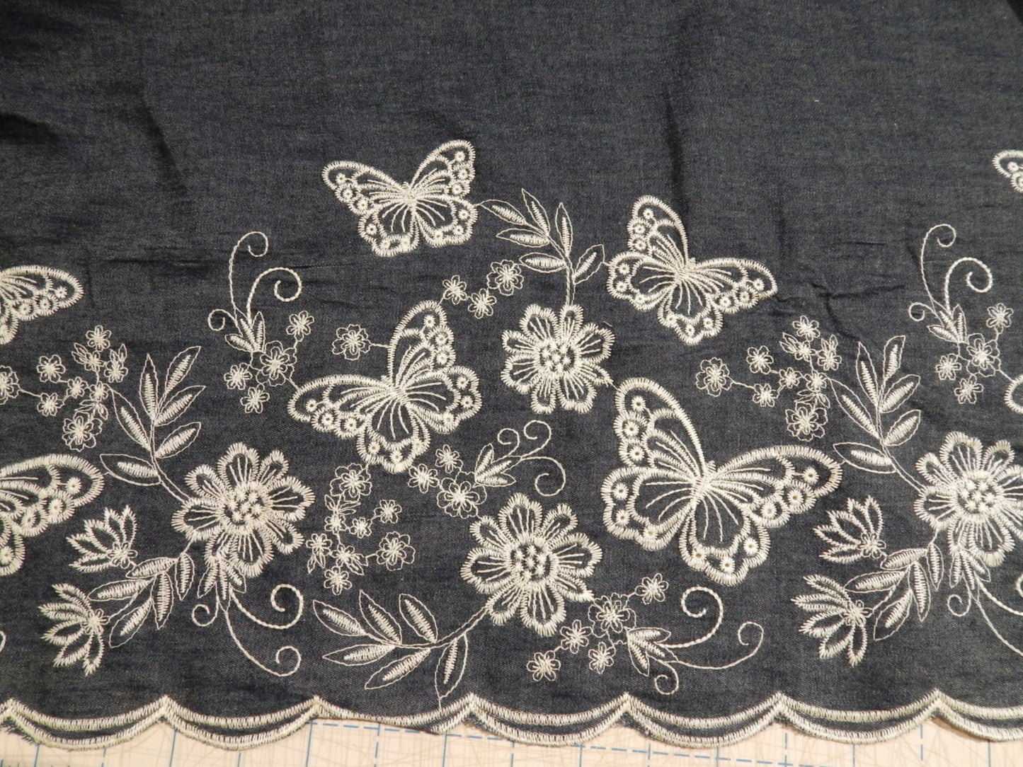 white butterfly embroidered border double scalloped denim chambray cotton deadstock fabric