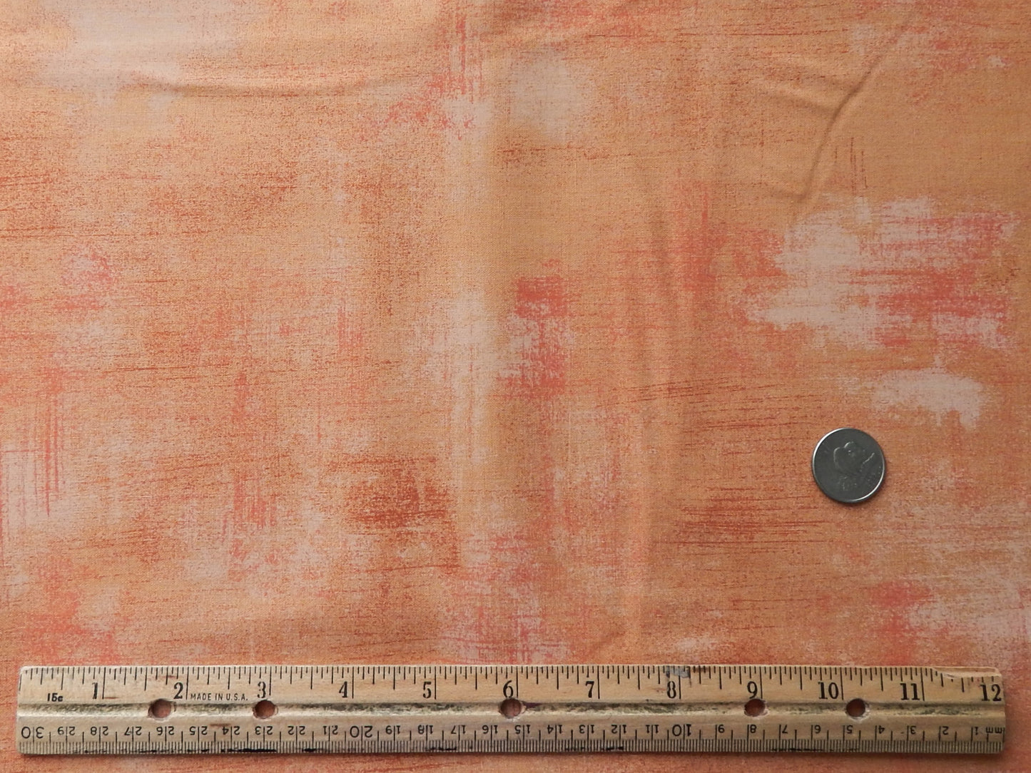 multicolored orange and brick red cotton fabric