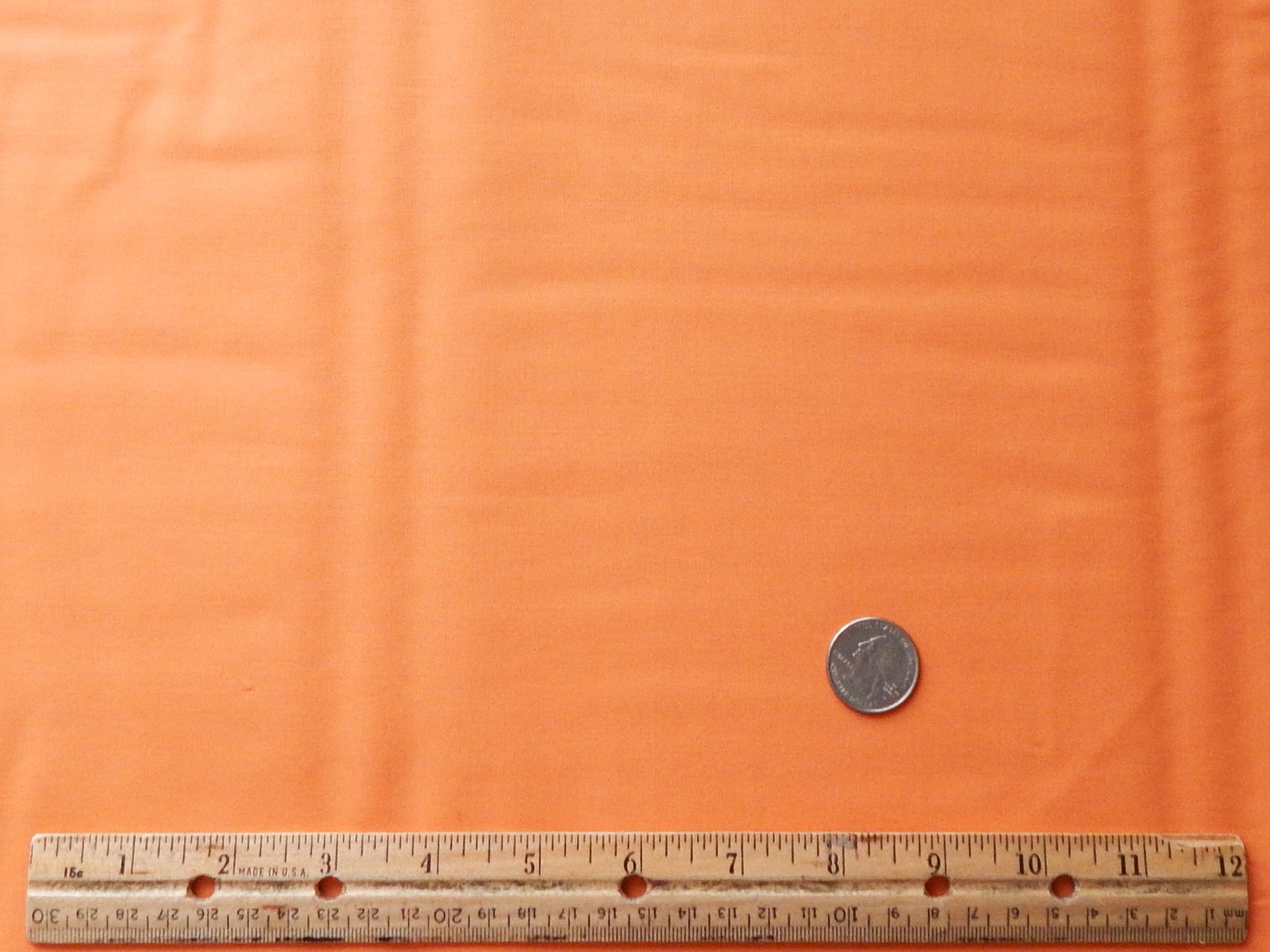 solid light orange cotton fabric