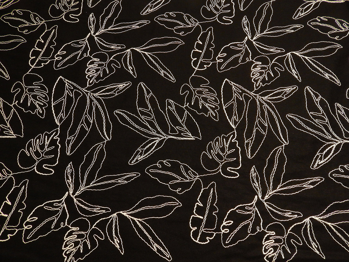 black and natural monstera leaf couched linen and rayon blend telio fabric