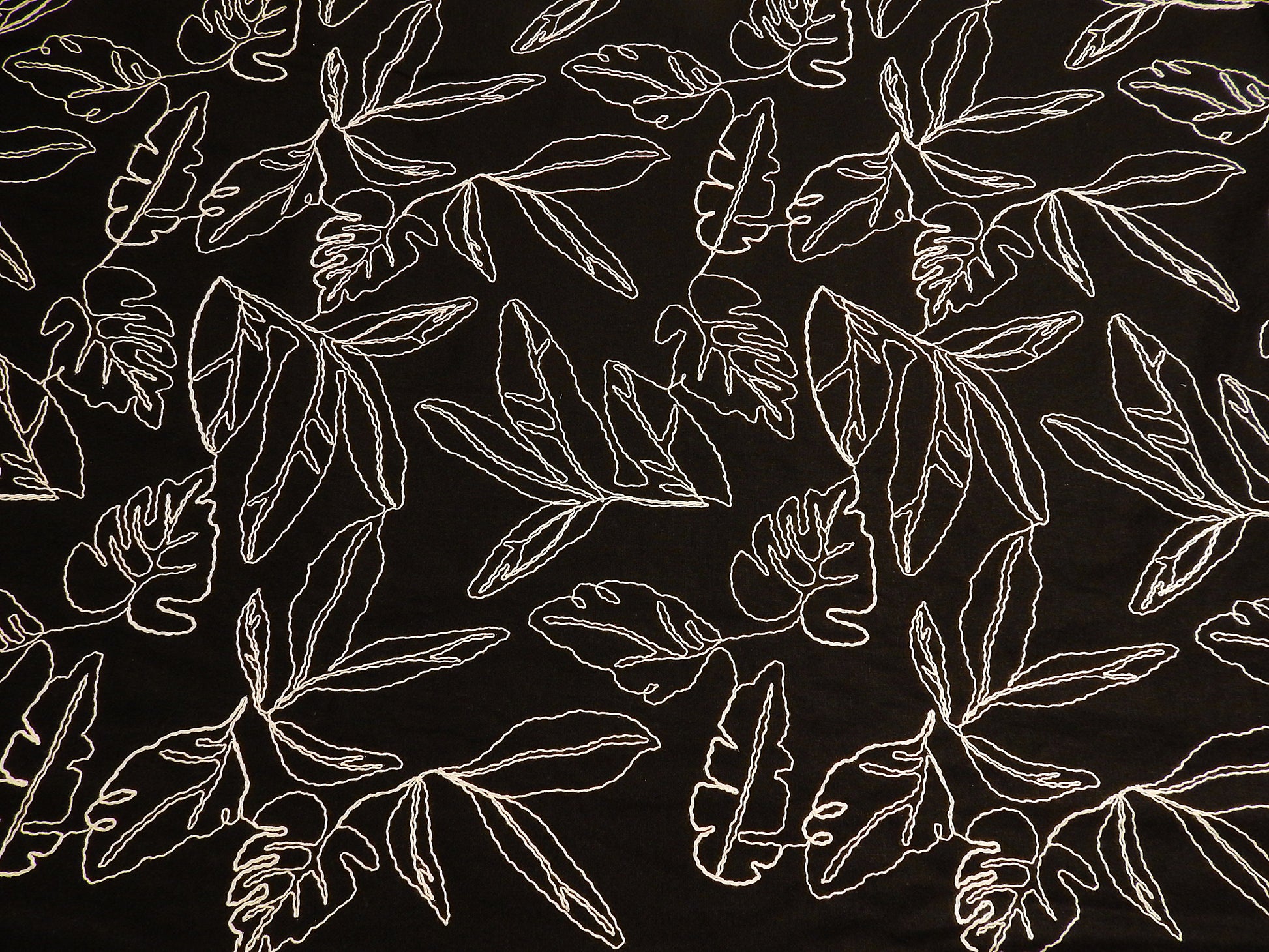 black and natural monstera leaf couched linen and rayon blend telio fabric
