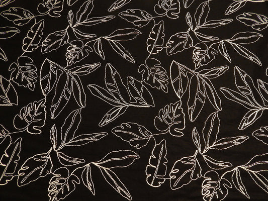 black and natural monstera leaf couched linen and rayon blend telio fabric