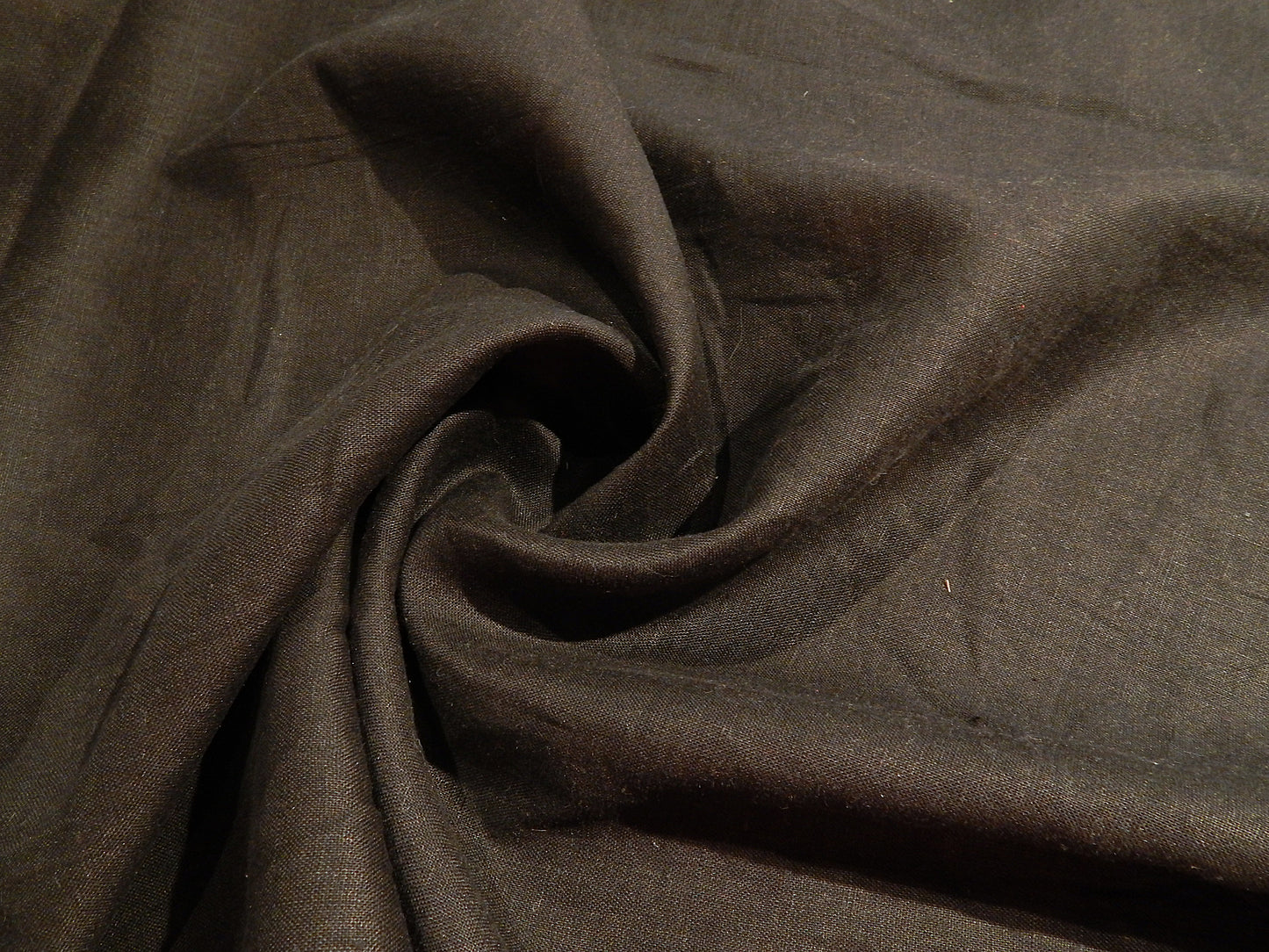 solid black pre interfaced linen with synthetic back already ironed on deadstock fabric