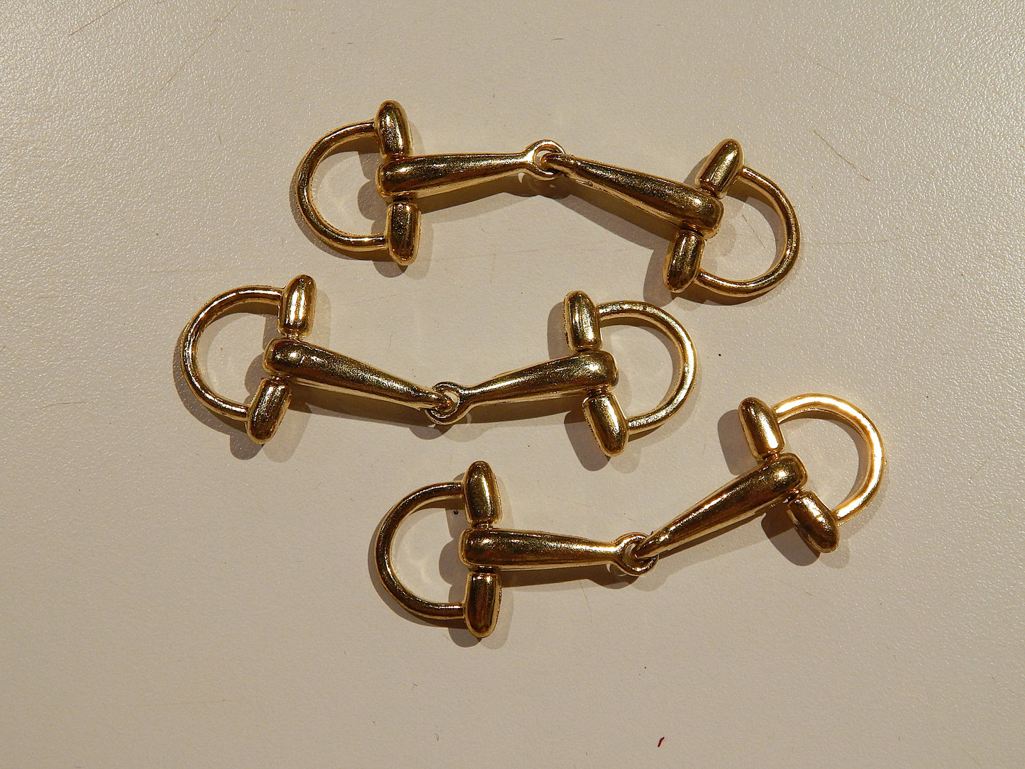 gold metal cloak and coat buckles military style