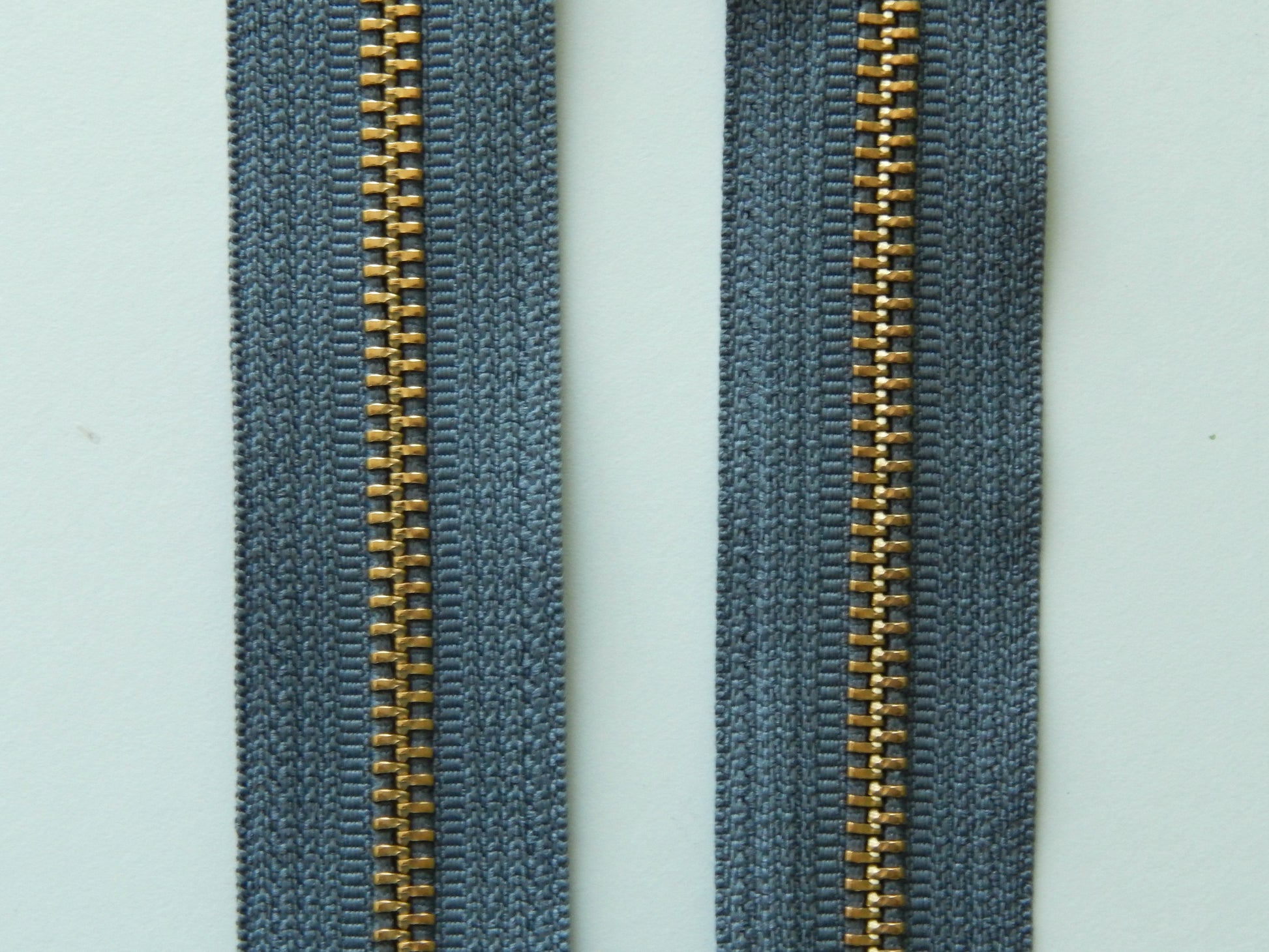 dark gray and gold zipper