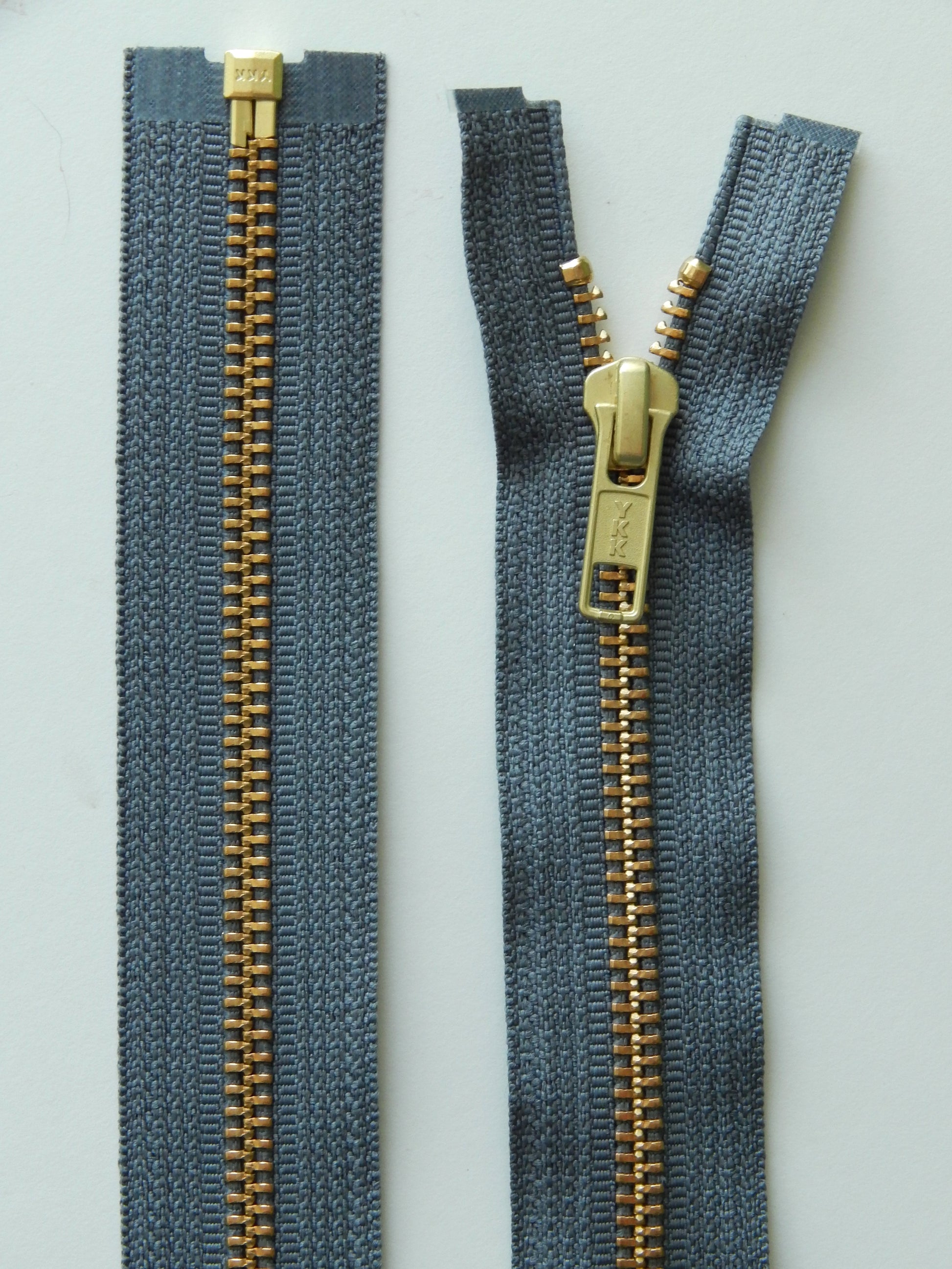 dark grey and brass gold separating jacket zippers