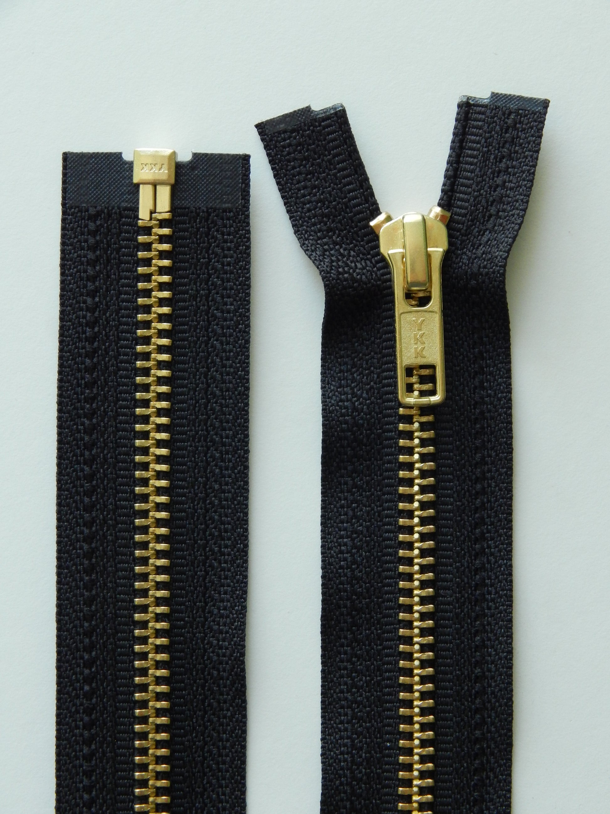 black and brass gold separating jacket zippers