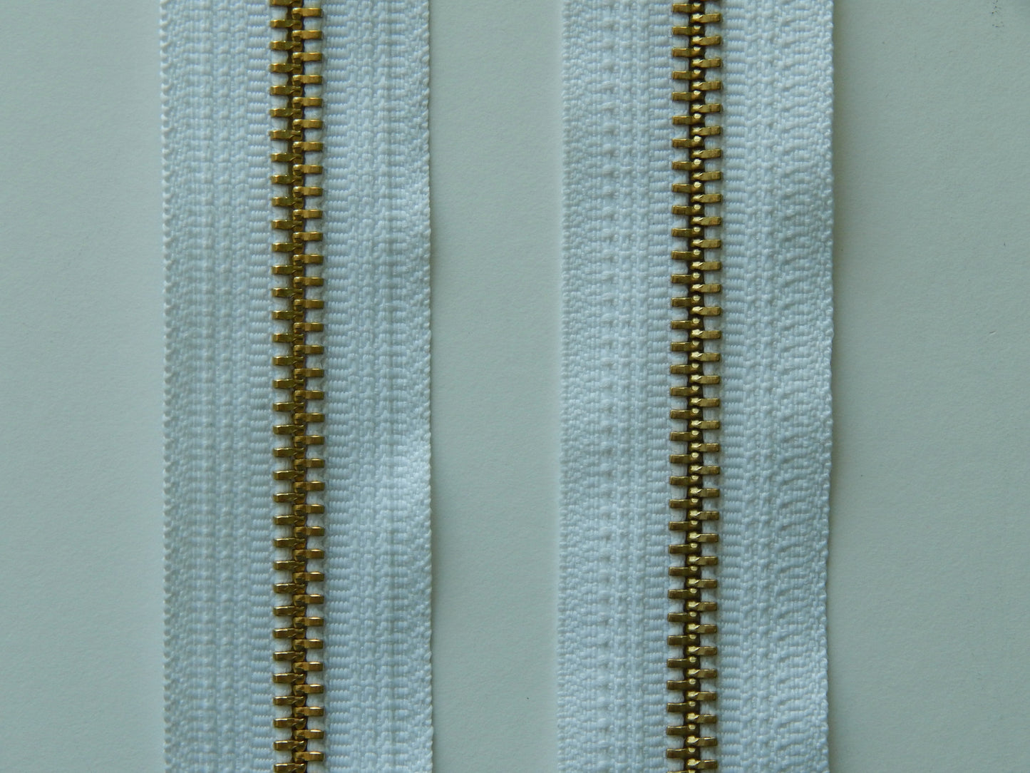 white and gold zippers