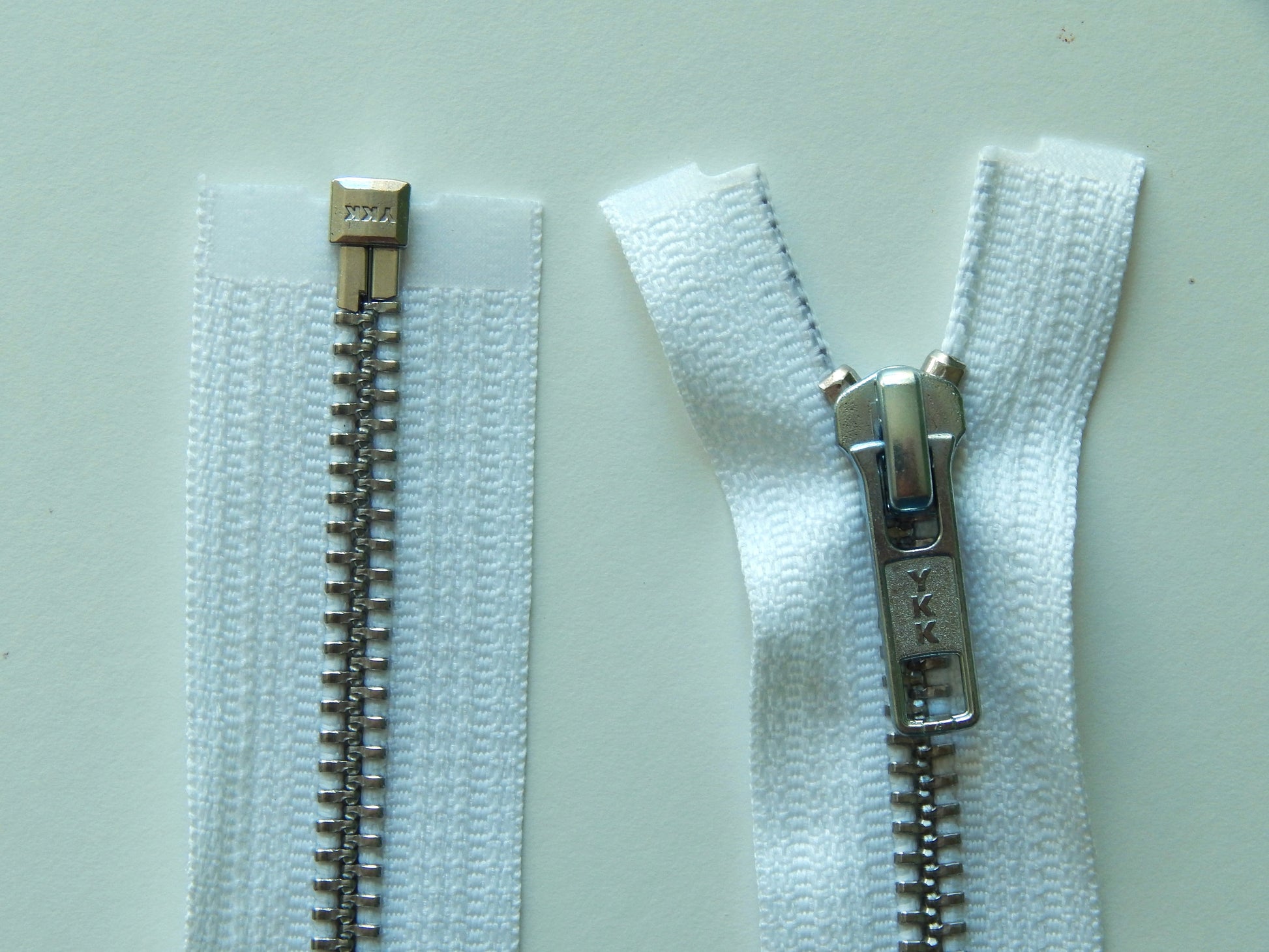 white and silver jacket zipper
