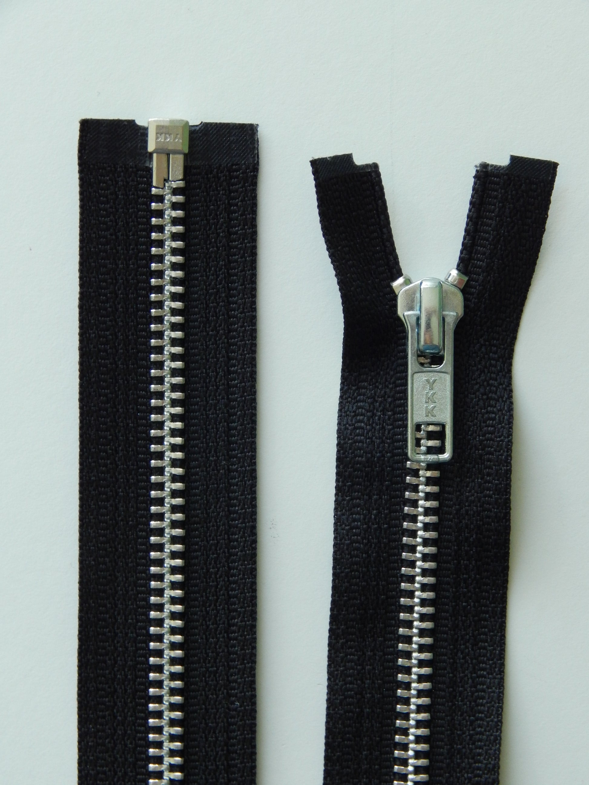 black and silver separating zipper