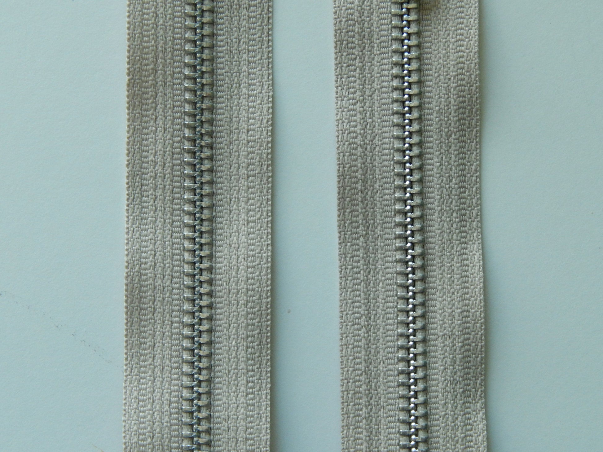 khaki and silver zipper