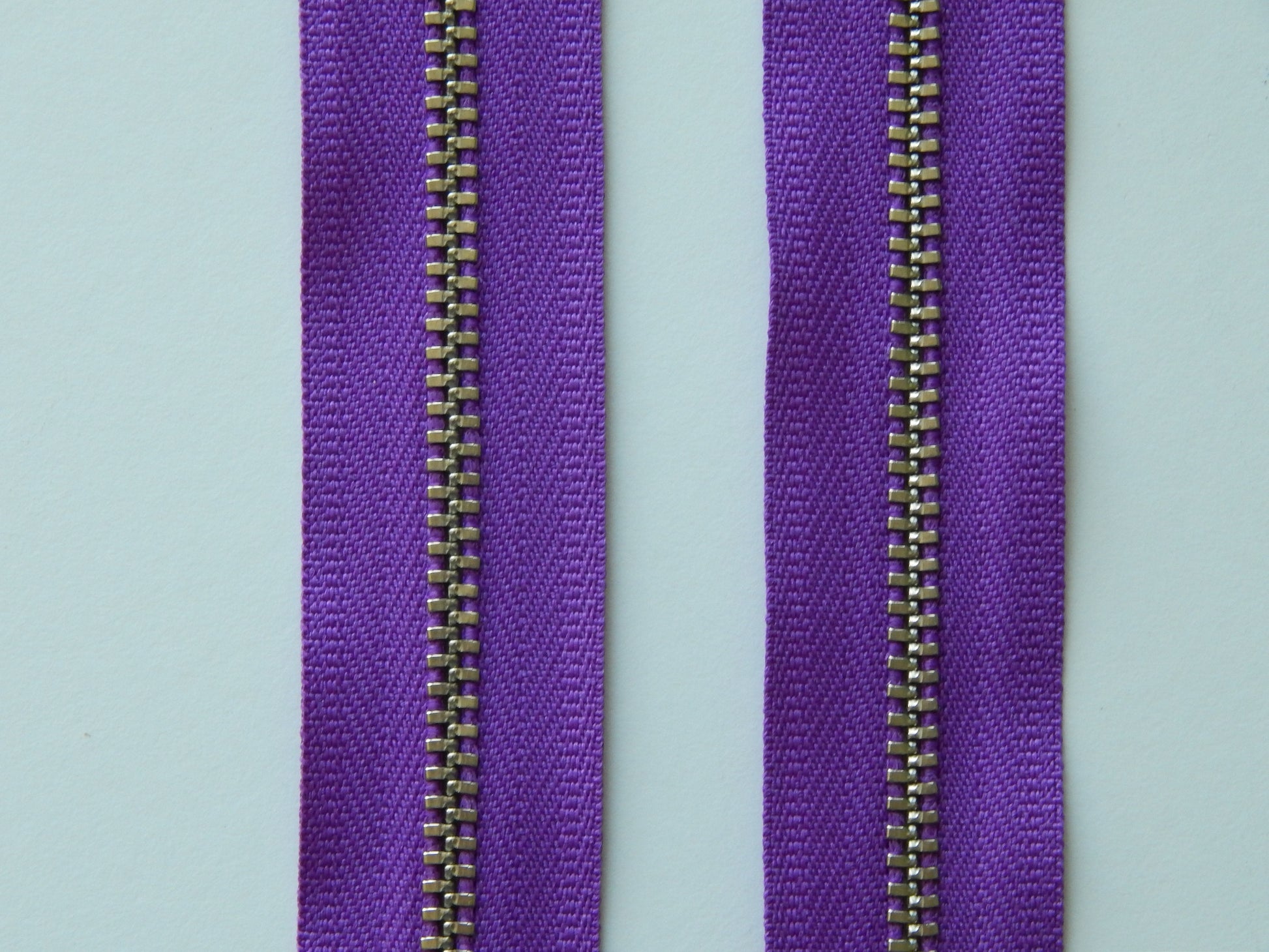 violet and nickel zipper