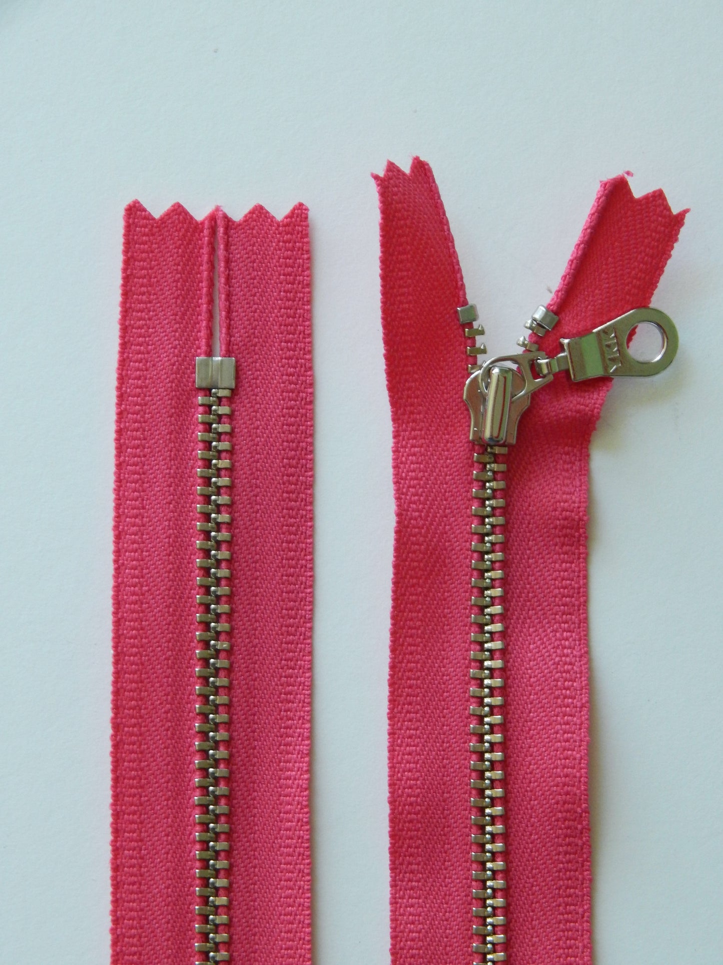 hot pink and silver nonseparating zipper