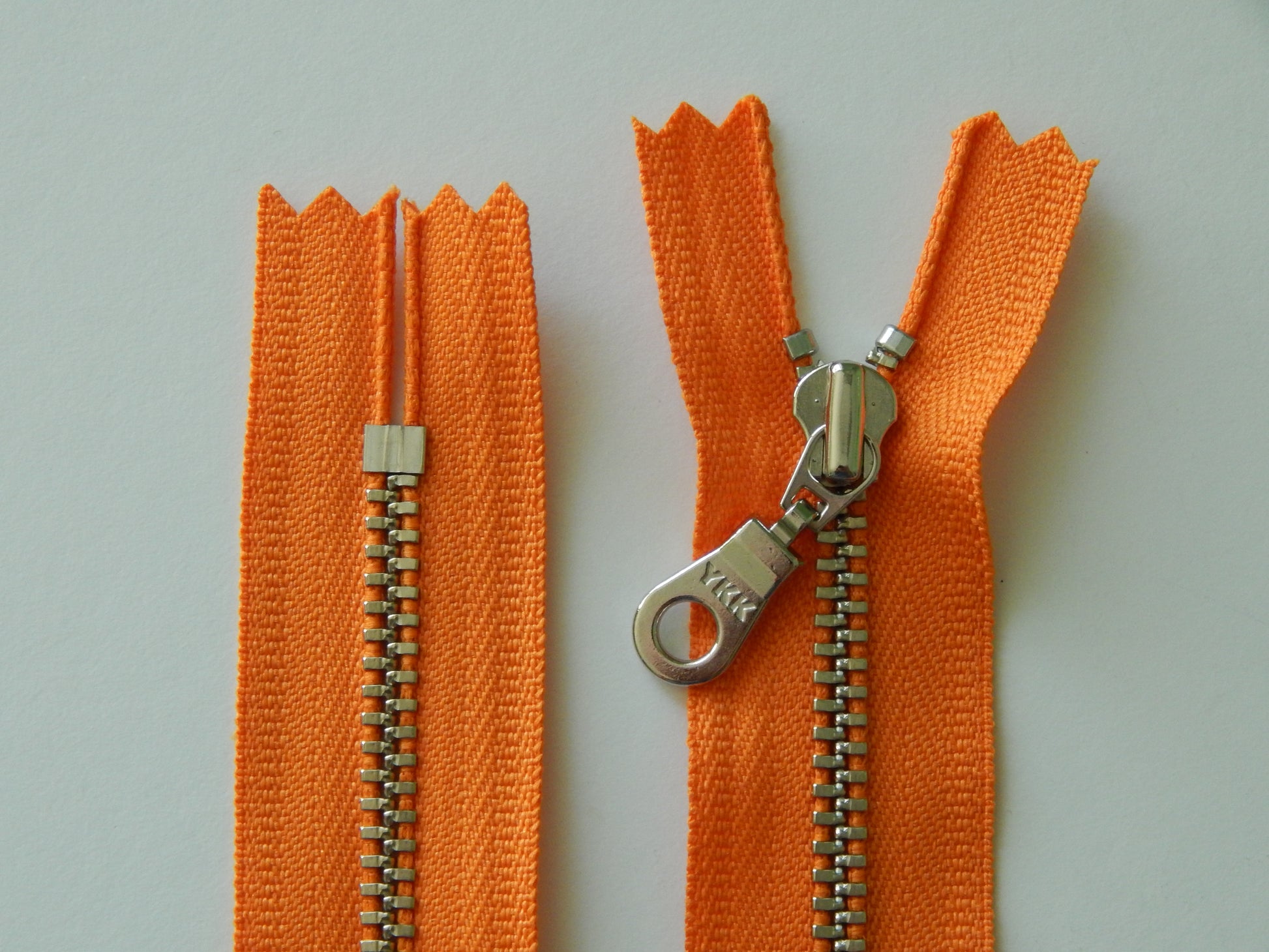 orange and silver purse zipper