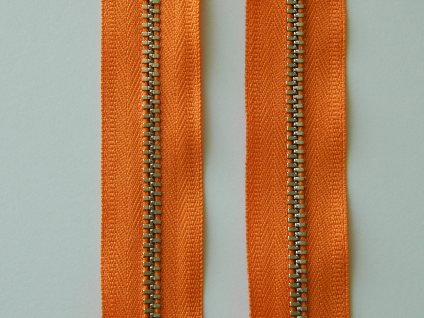 orange and nickel zipper
