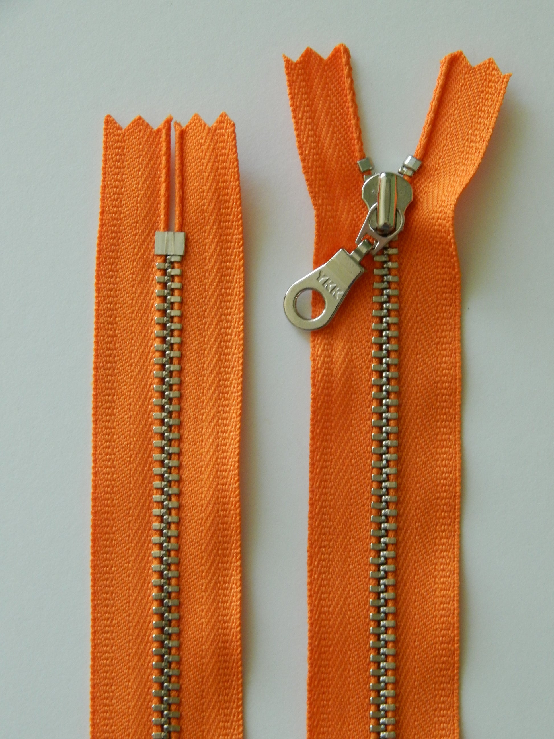orange and silver nonseparating zipper