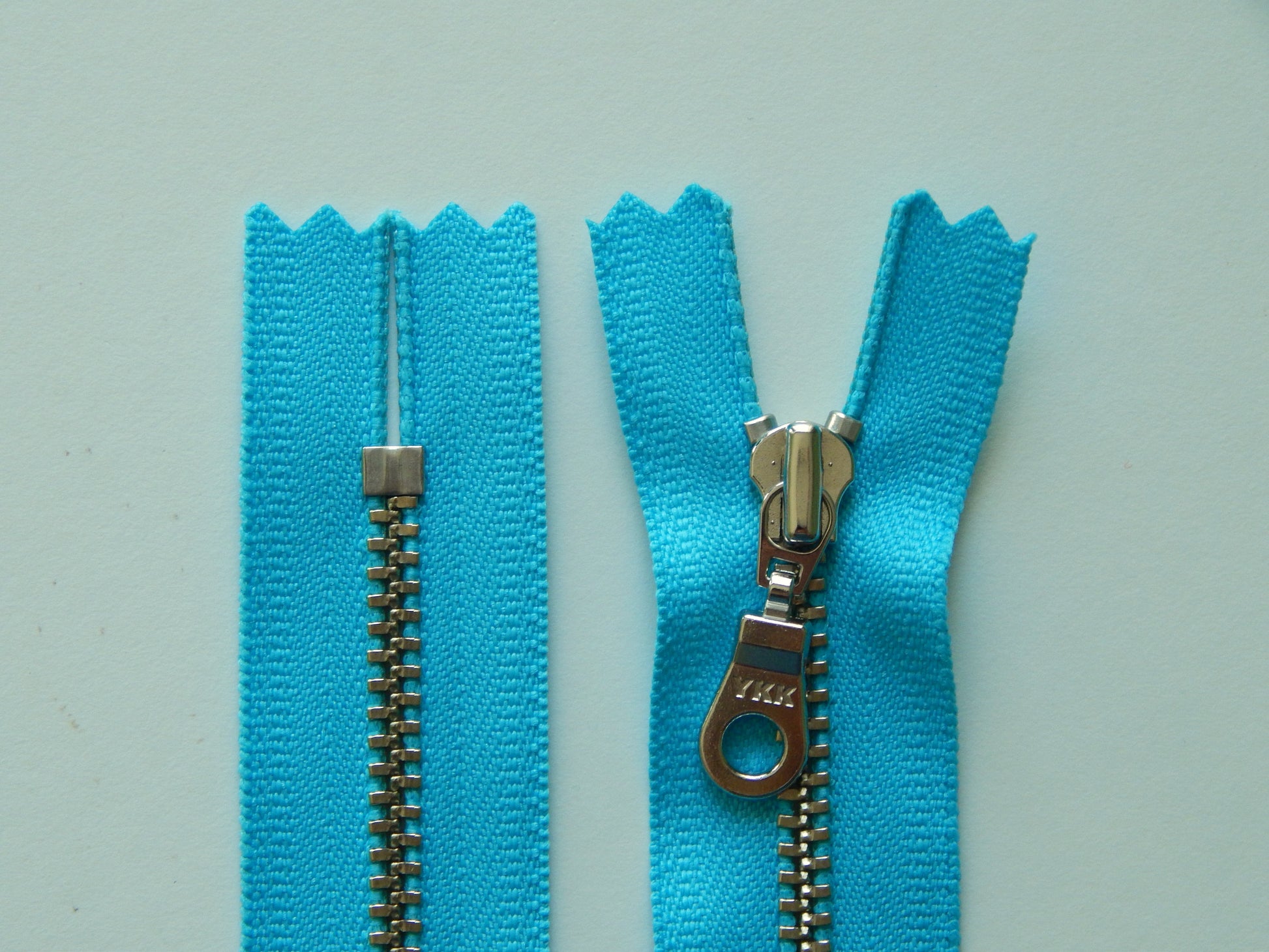 blue and silver bag pull zipper