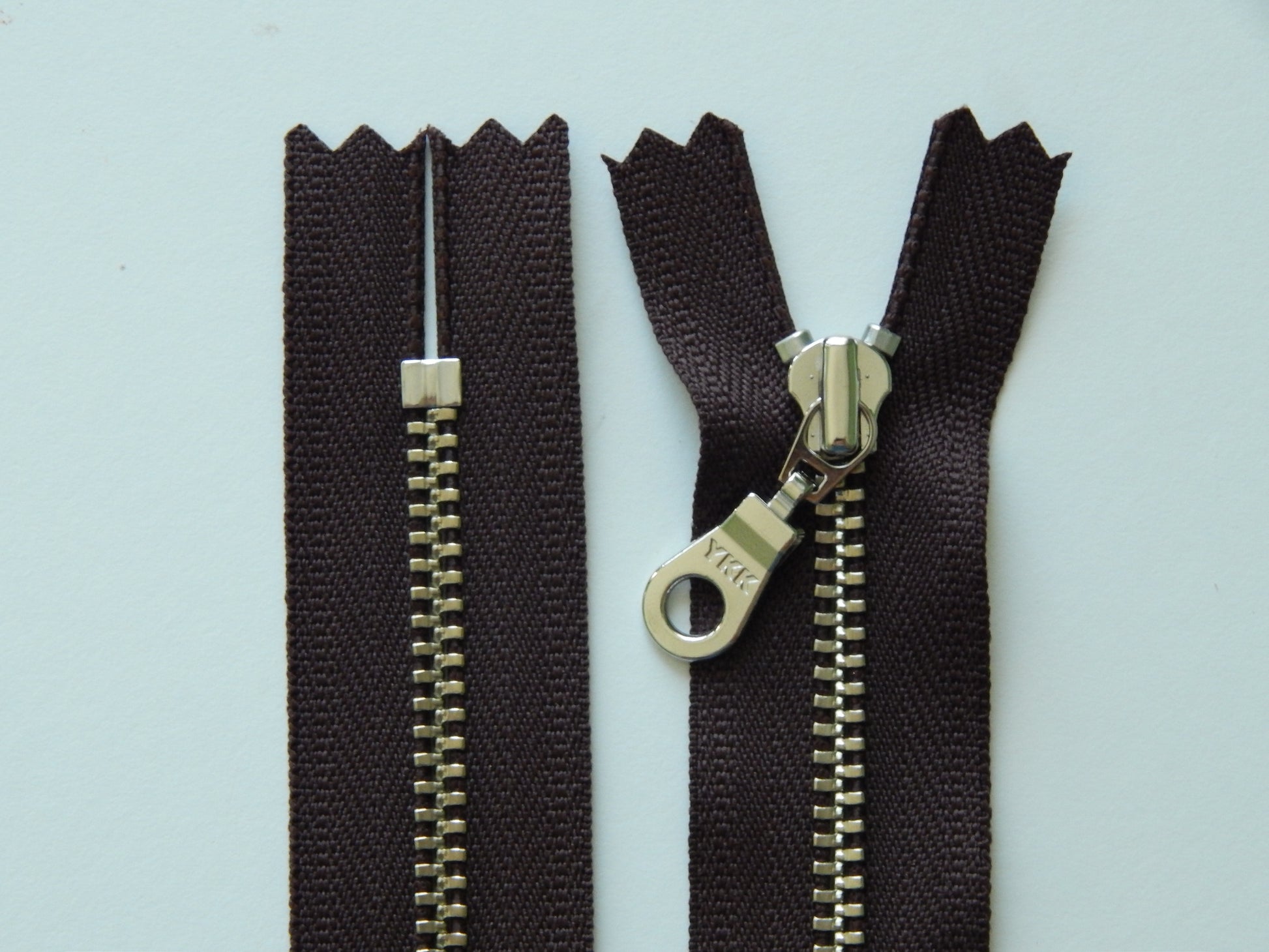 dark brown and silver purse zipper