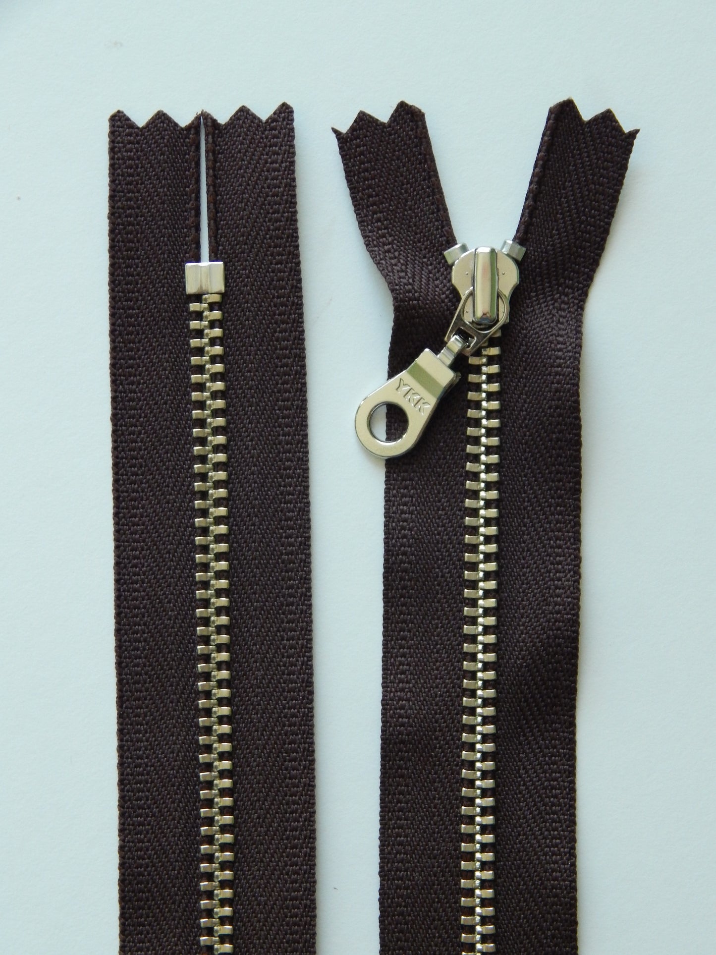 brown and silver nonseparating zipper