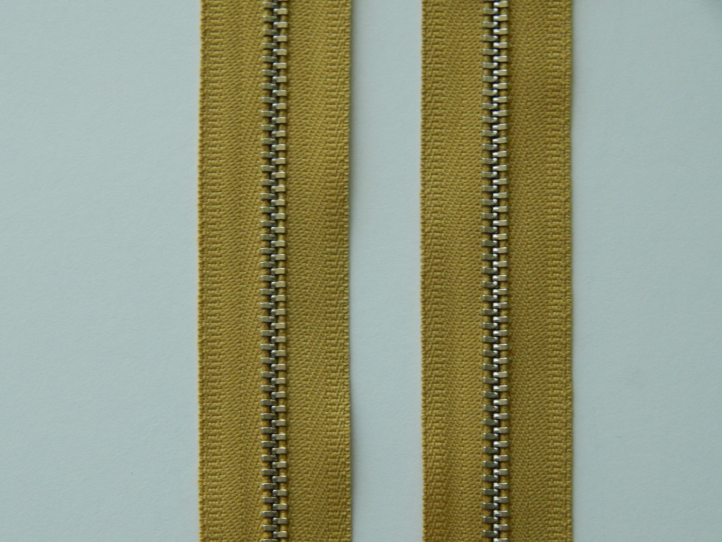 dark gold and nickel zipper