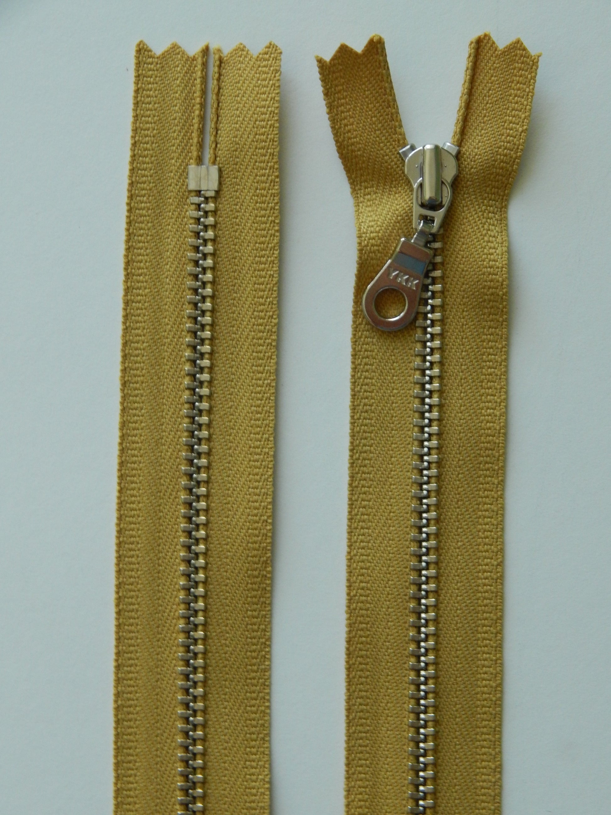 golden mustard and silver nonseparating zipper