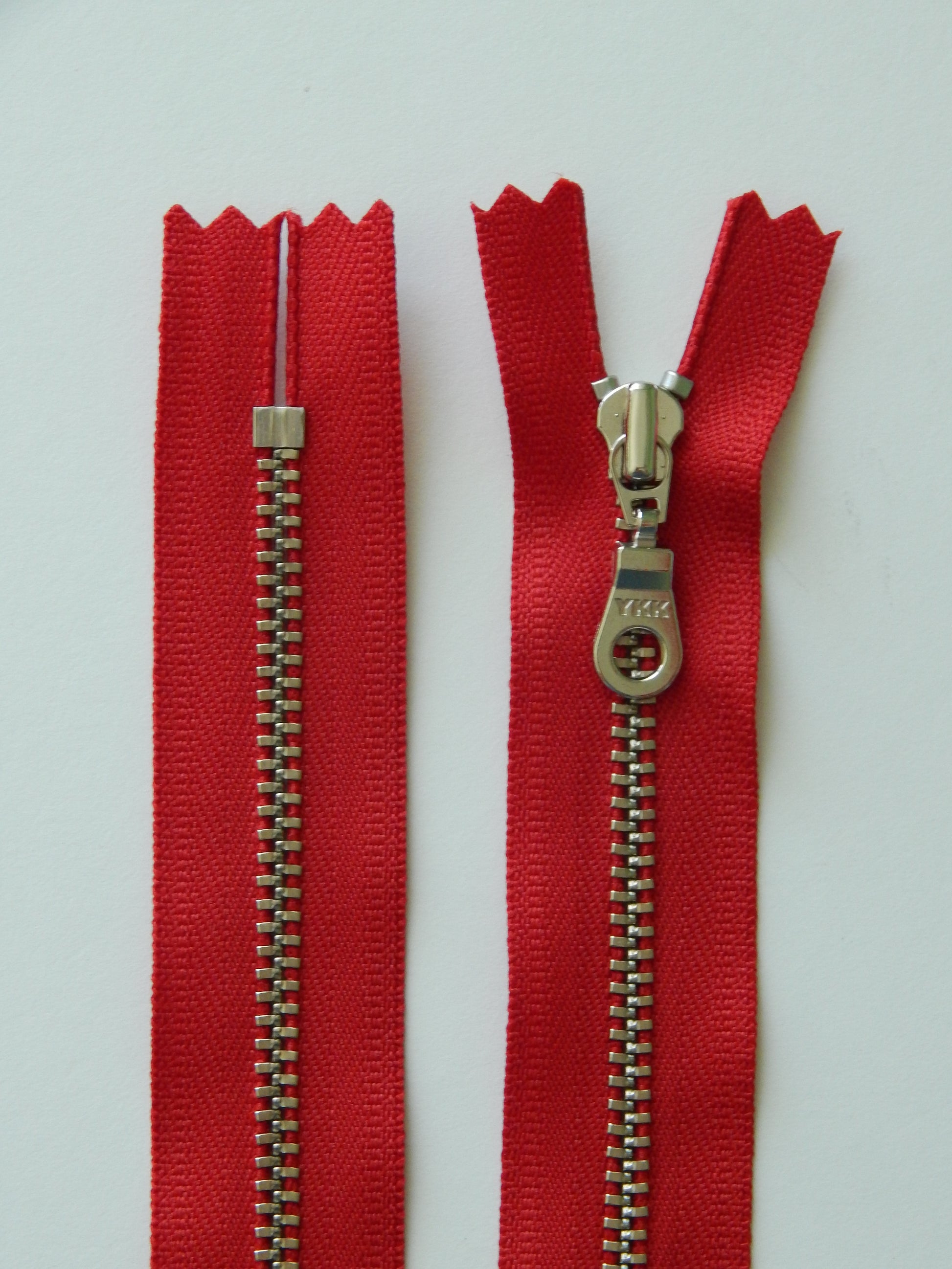 red and silver nonseparating zipper