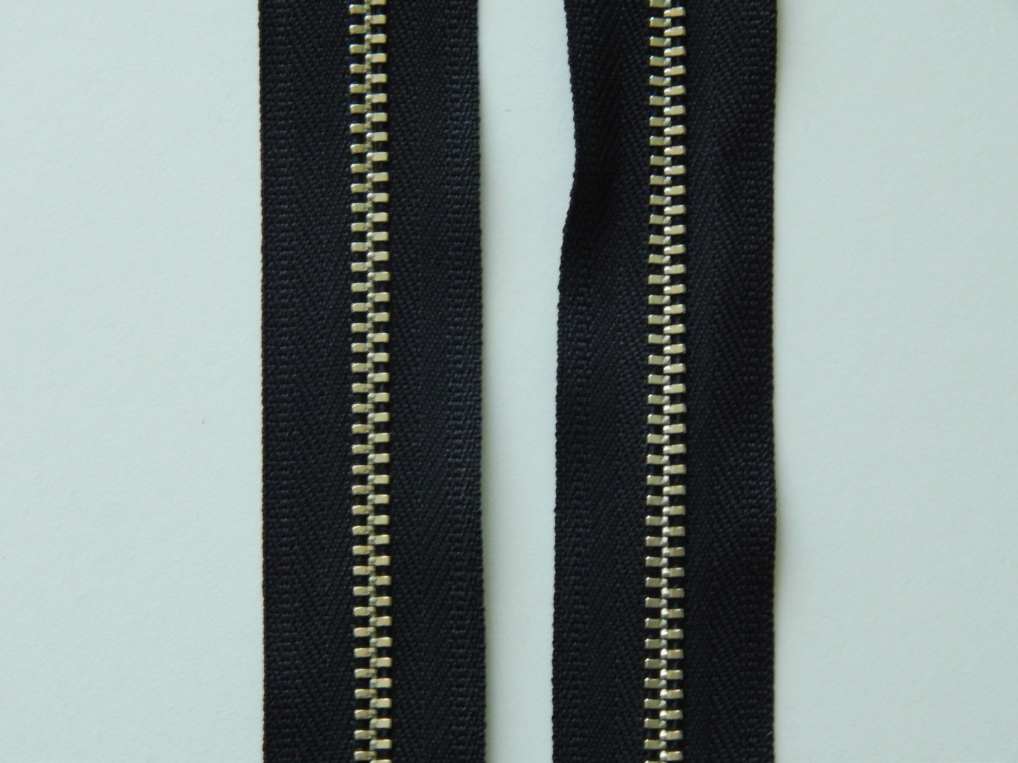 black and nickel zipper