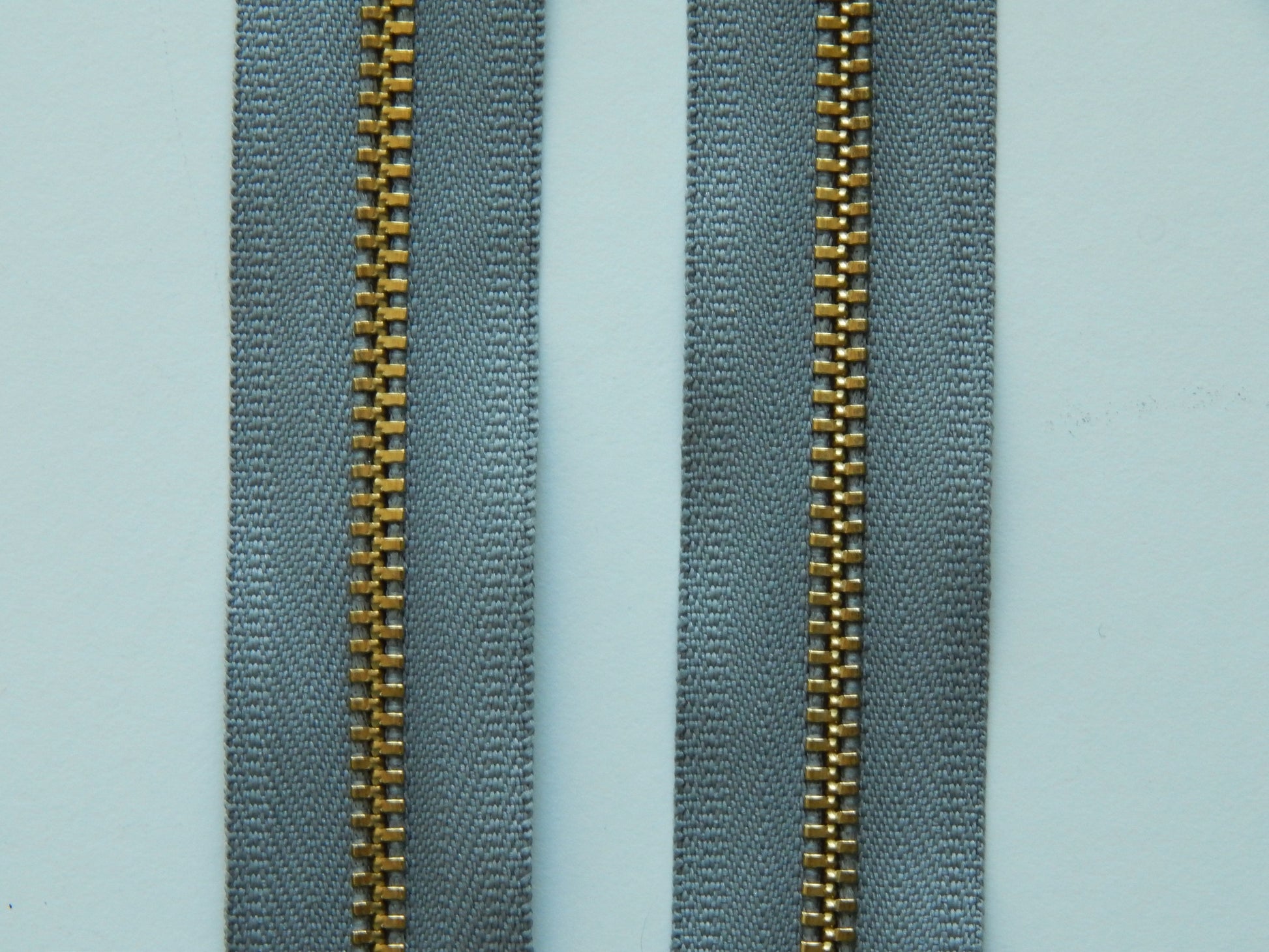 slate grey and bronze zipper