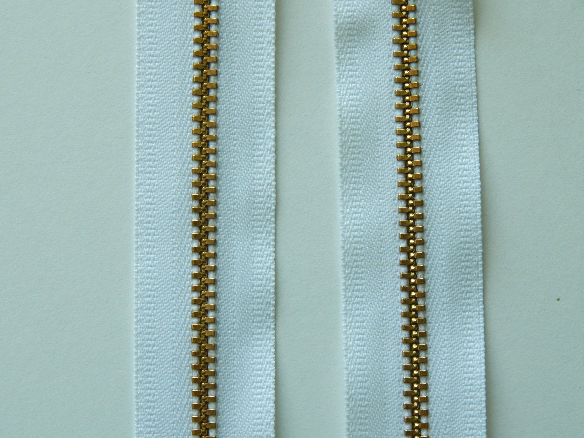 white and gold zipper