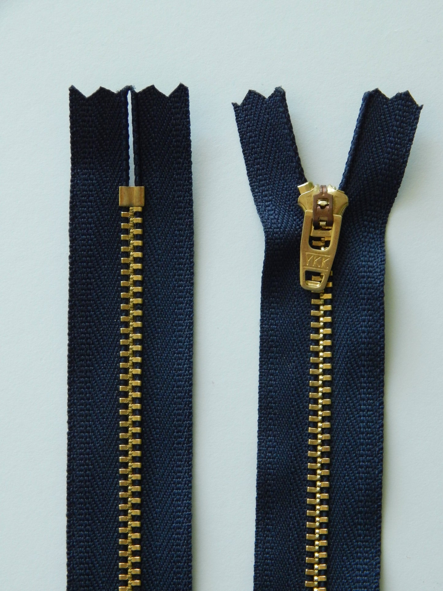 dark blue and brass gold nonseparating pant zipper