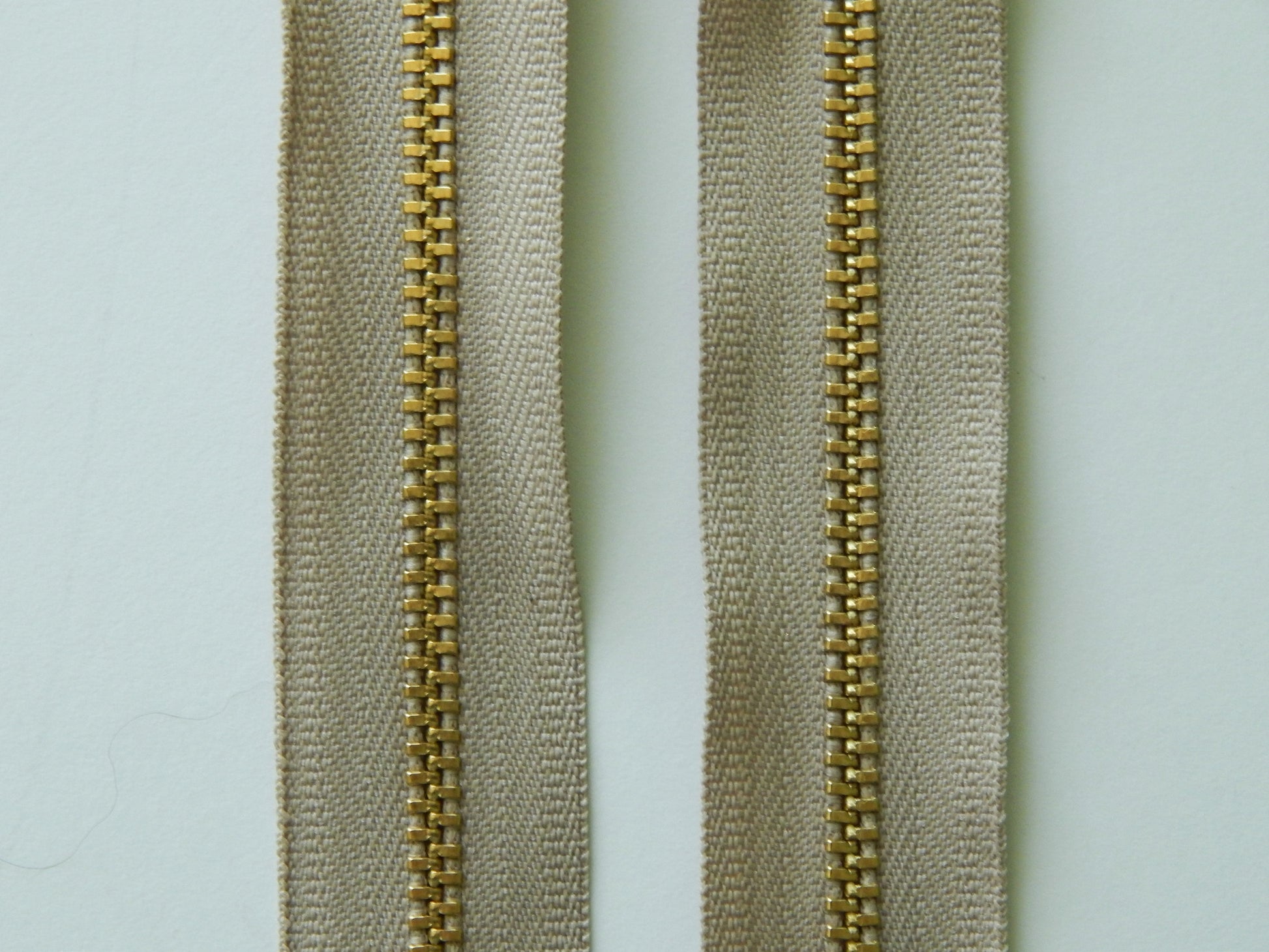 beige and gold zipper