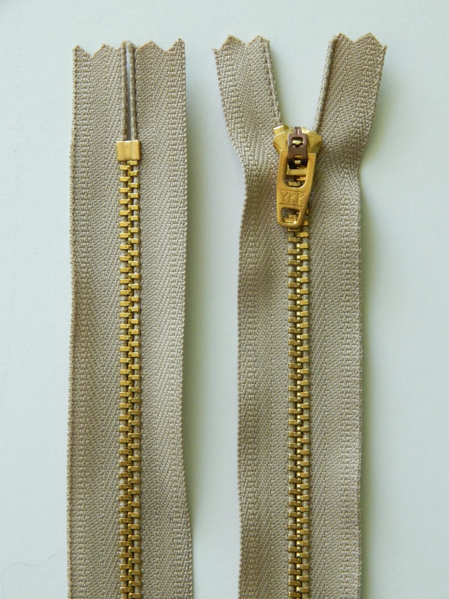 khaki and brass gold nonseparating pant zipper