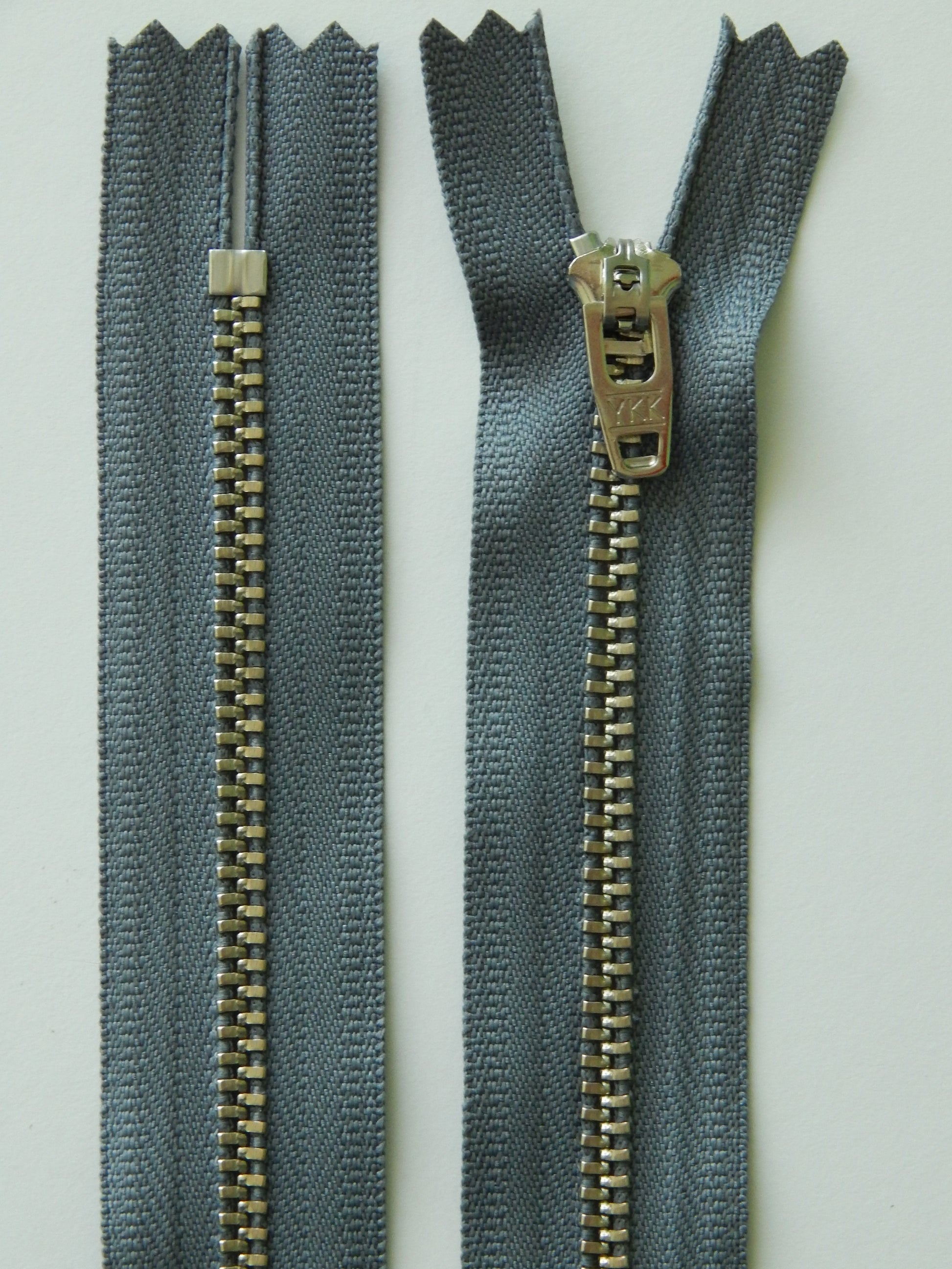 medium gray and silver metal nonseparating pant zipper