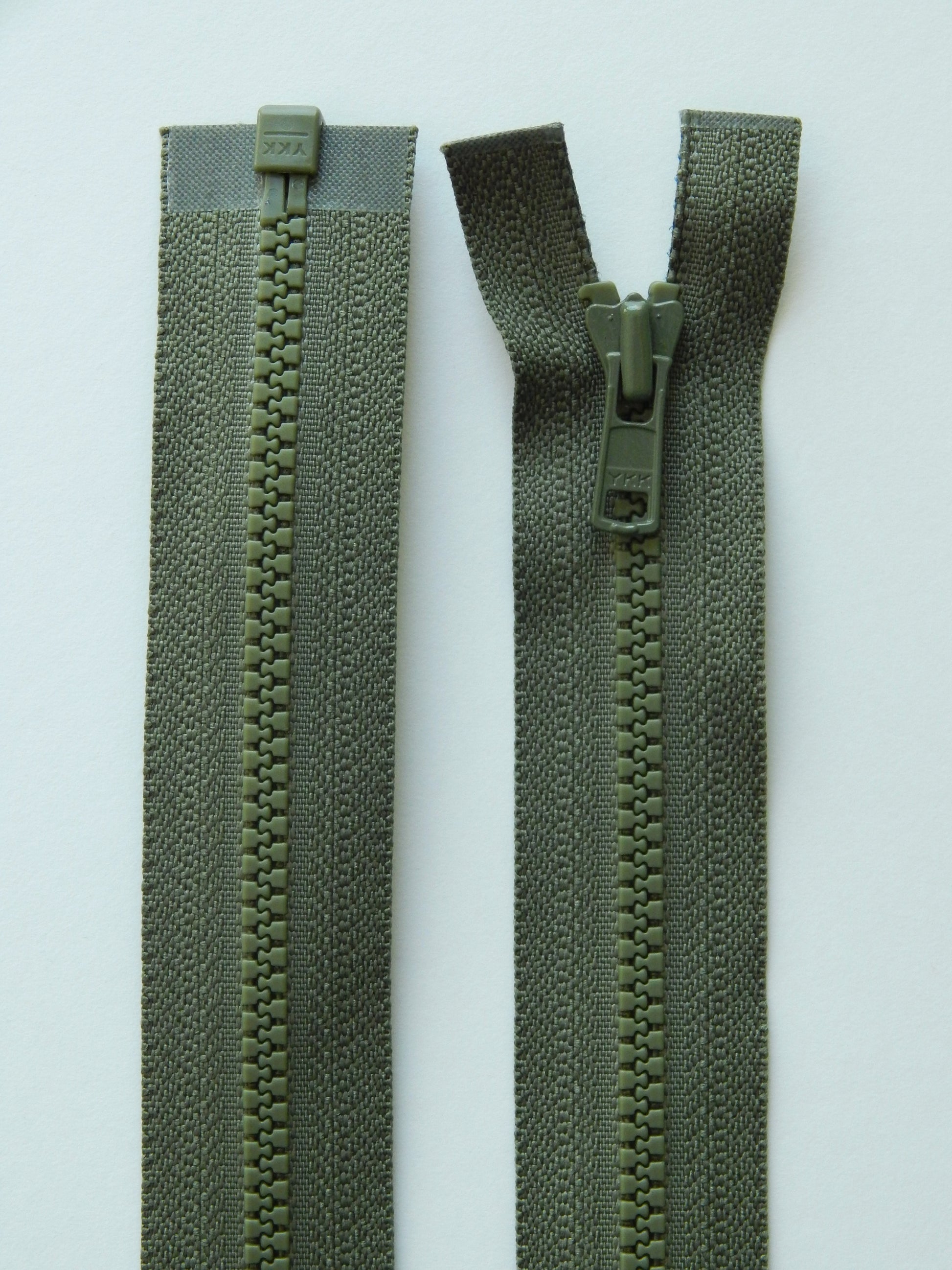 olive green molded plastic sport separating jacket zipper