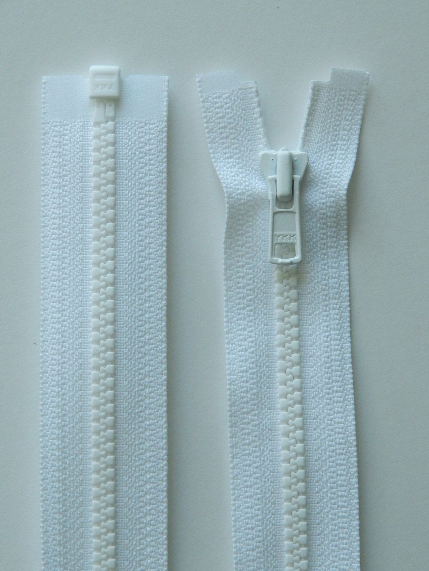 white molded plastic sport separating jacket zipper