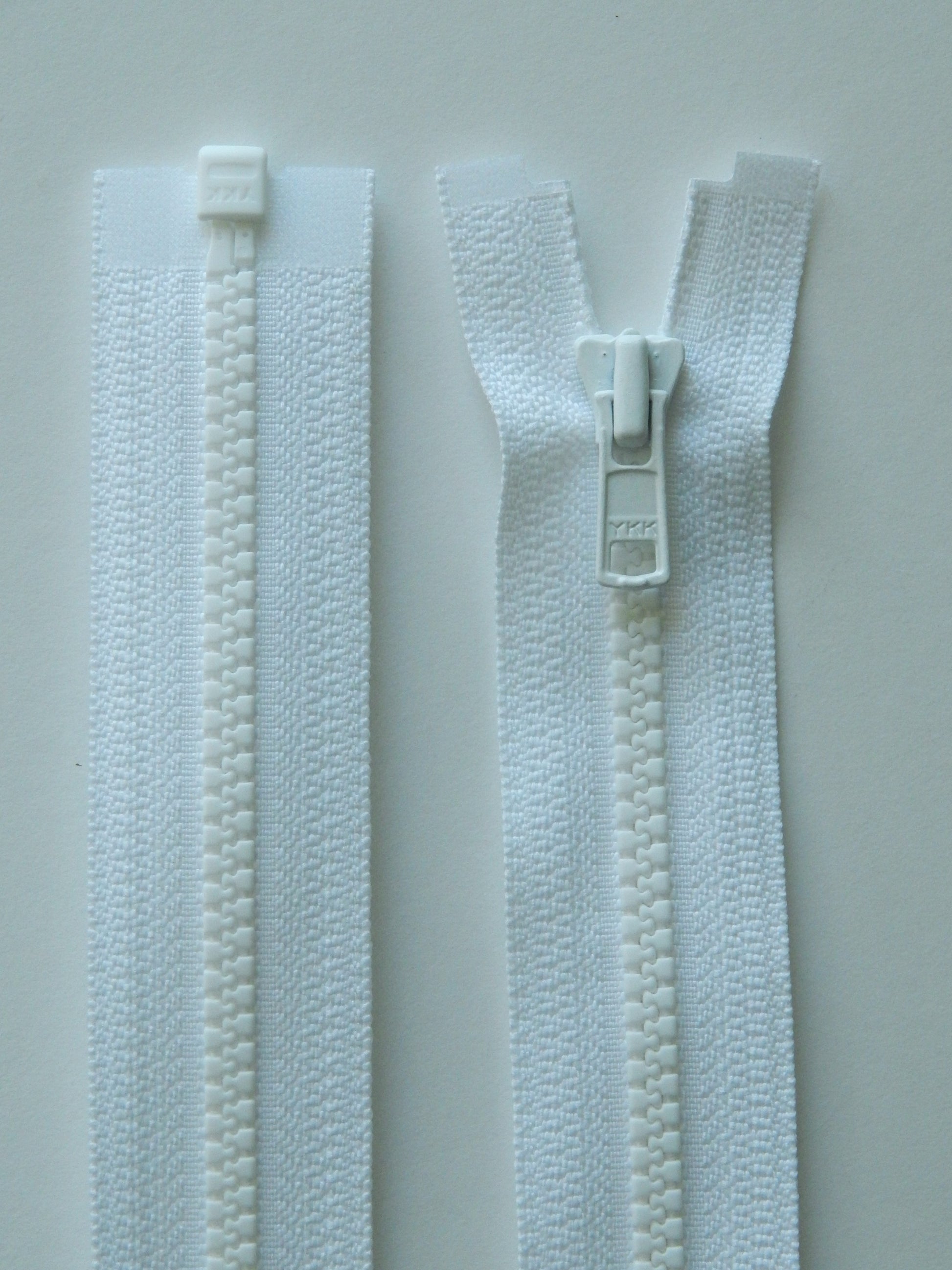 white molded plastic sport separating jacket zipper